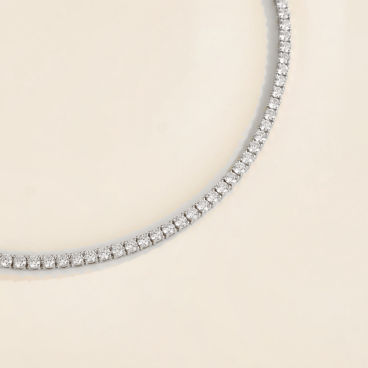 Stacy diamond round tennis necklace in white gold, angle view
