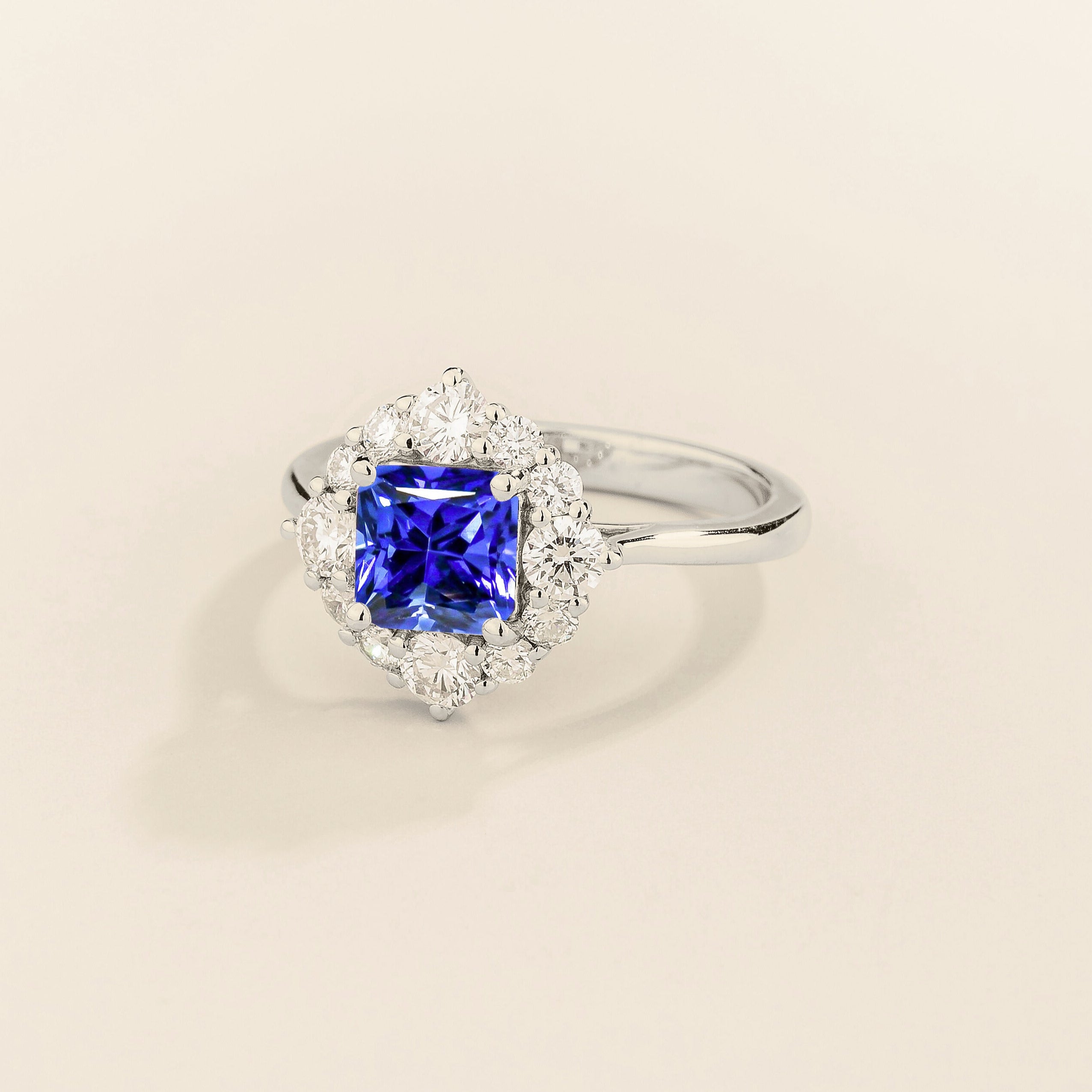 Tuli halo ring in white gold set with Blue Sapphire and Diamonds.