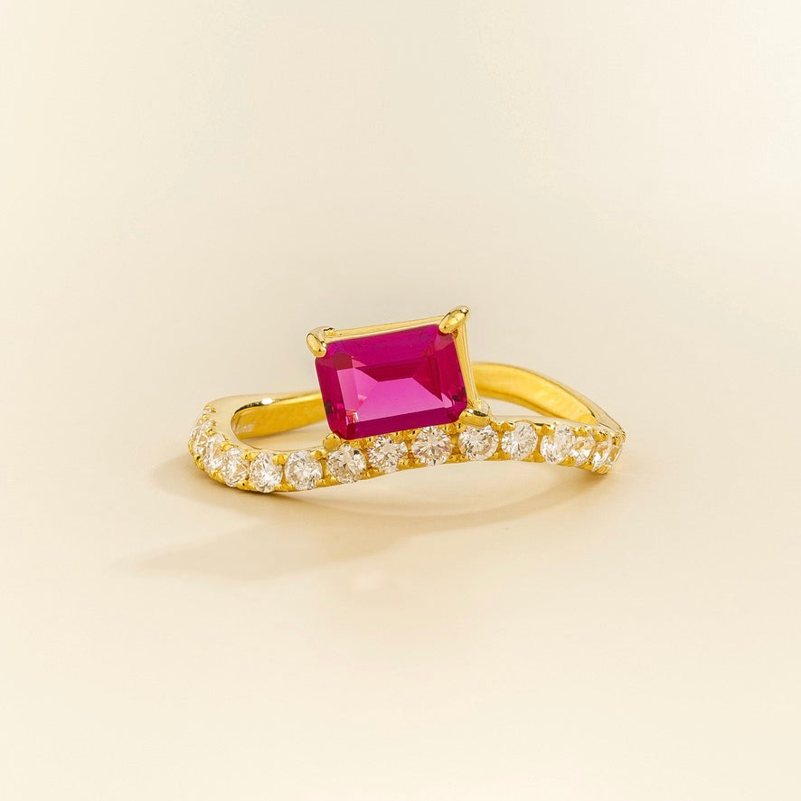 Luno vivid hot pink sapphire emerald-cut ring with diamond pavé in gold, lab-grown sapphire set east-west, front view | Juvetti London