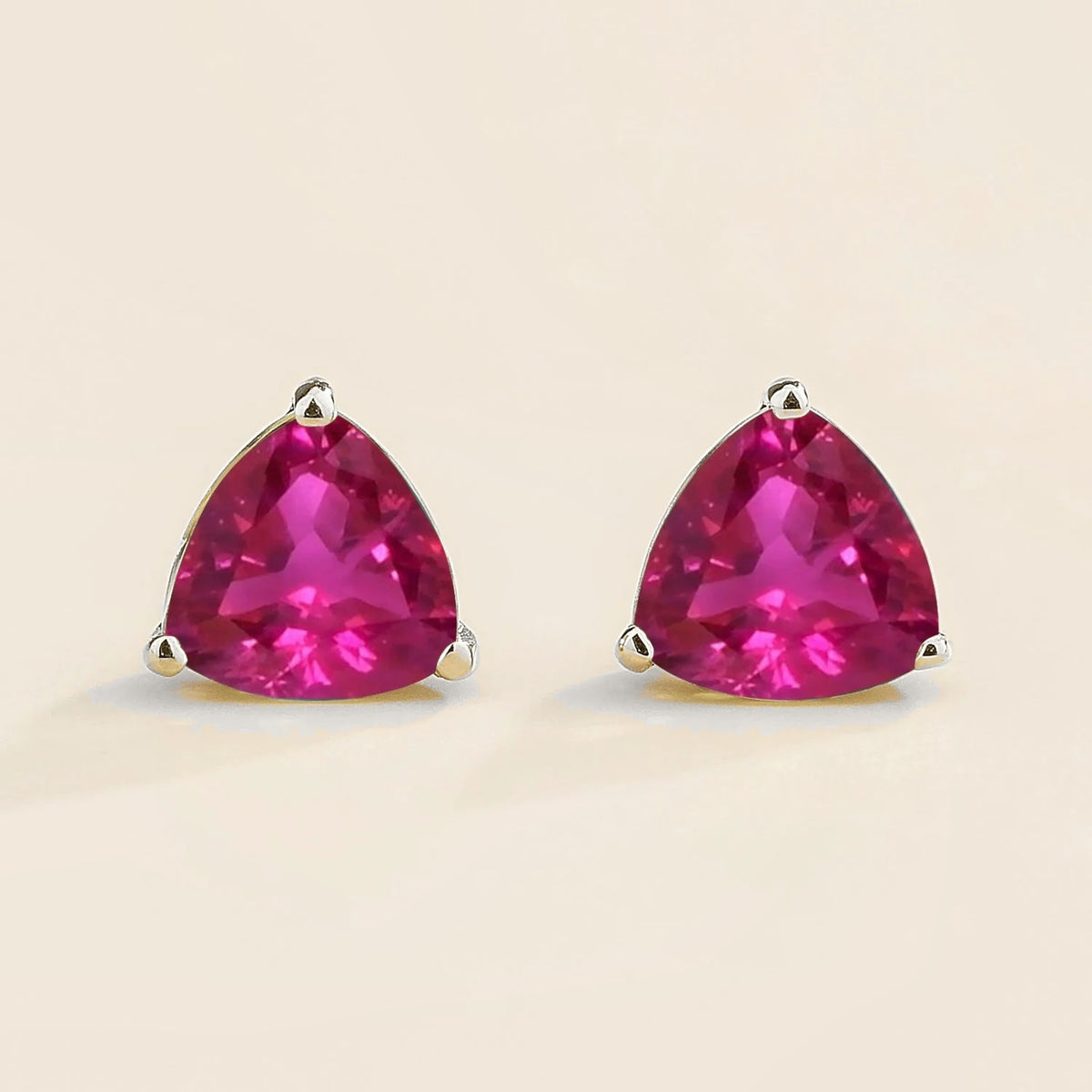 Trillion vivid pink sapphire solitaire stud earrings in white gold