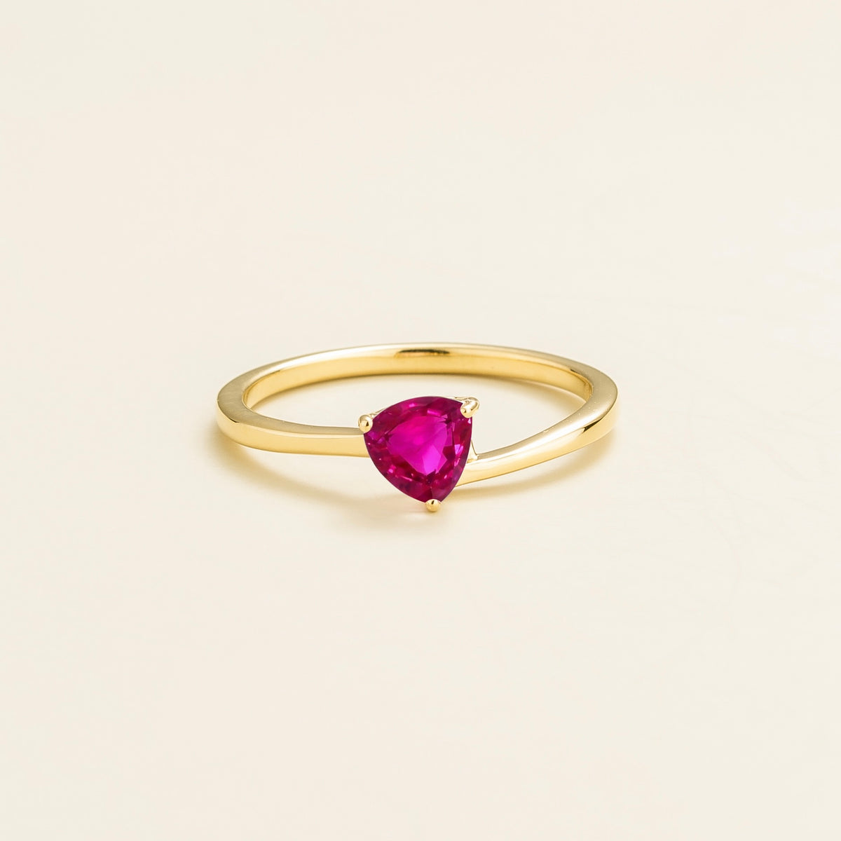 Trillion vivid pink sapphire solitaire ring in gold