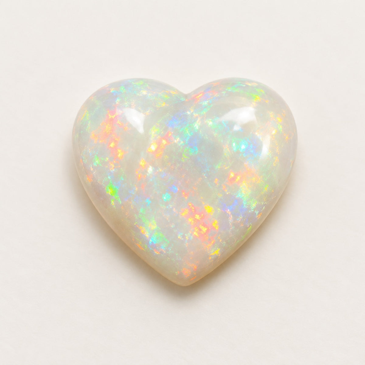 White lab-grown opal, heart cabochon