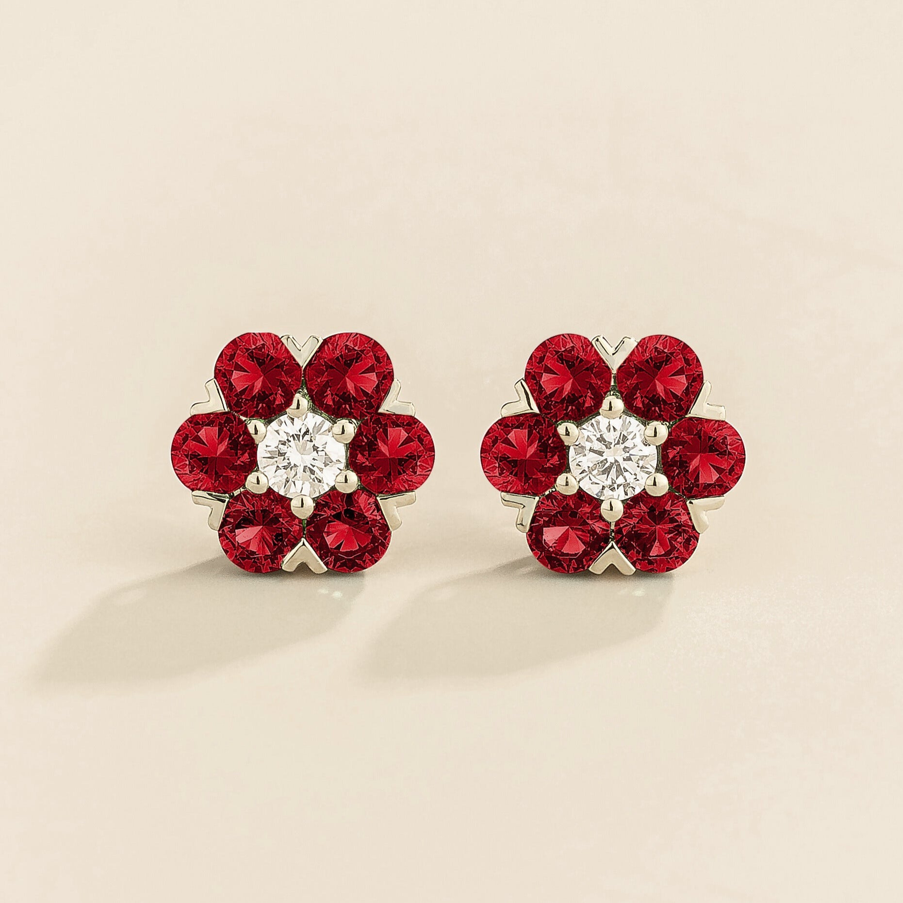 White gold version of cinq earrings in ruby and diamond.