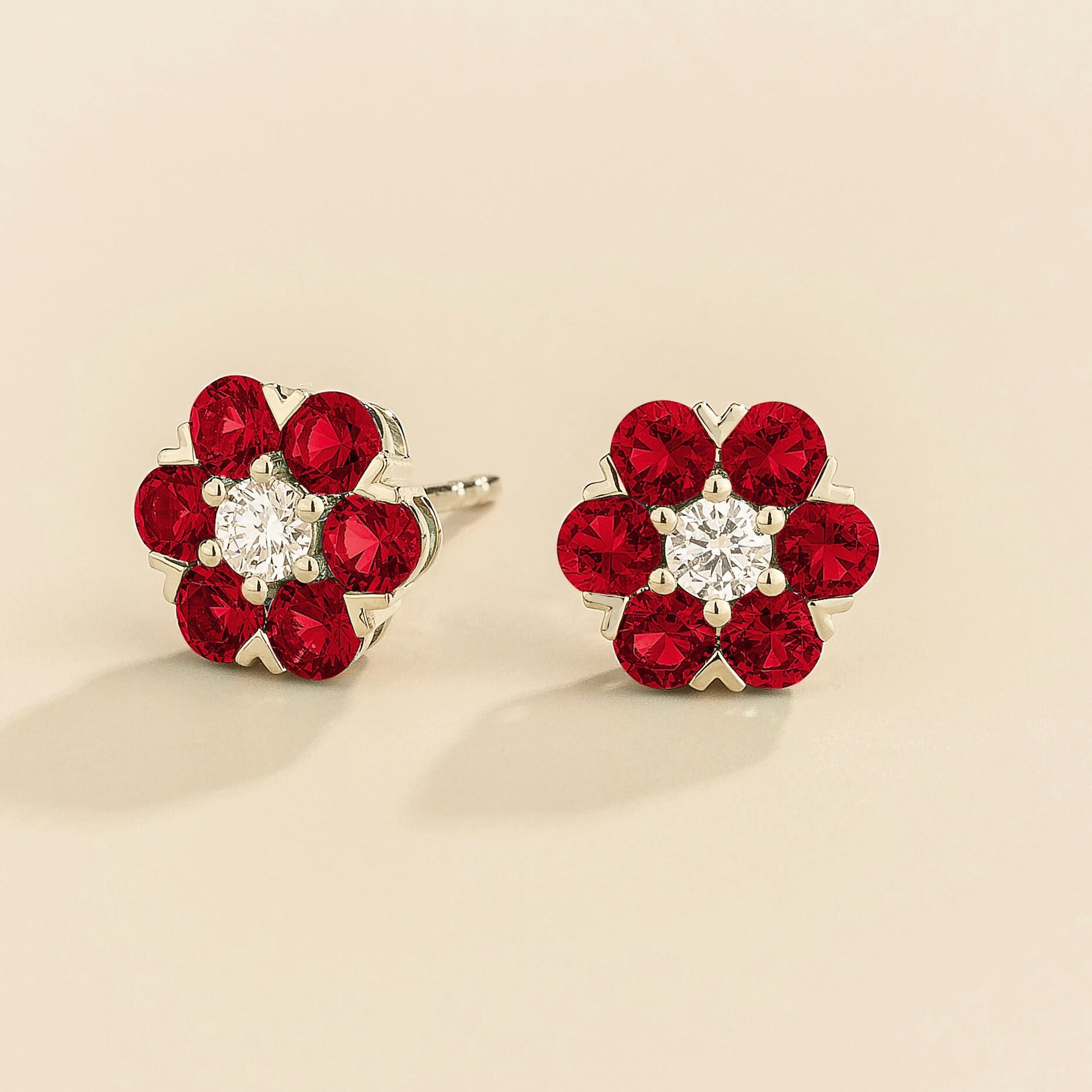 White gold version of cinq earrings in ruby and diamond.