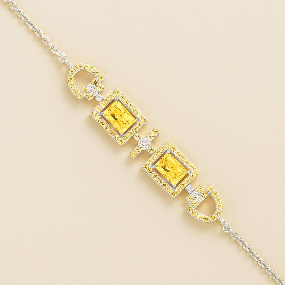 Ciceris yellow sapphire Art Deco halo bracelet in white gold, two emerald-cut lab-grown sapphires with diamonds, close-up | Juvetti London