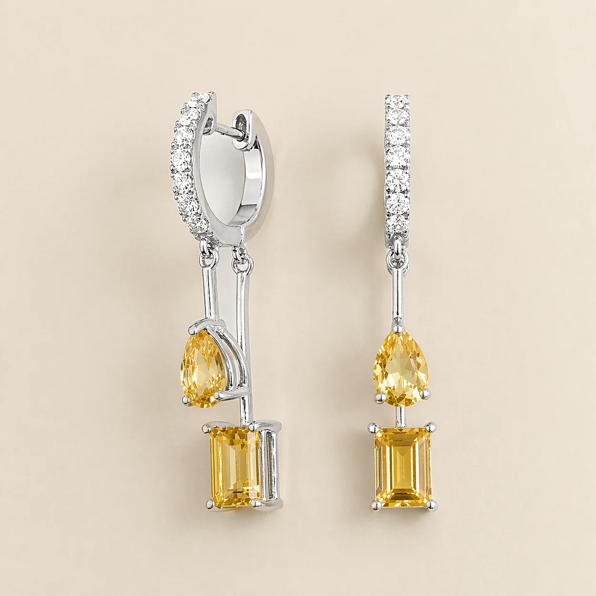 Faire yellow sapphire huggie drop earrings in white gold, pear and baguette-cut lab-grown yellow sapphires with diamond pavé, front view | Juvetti London