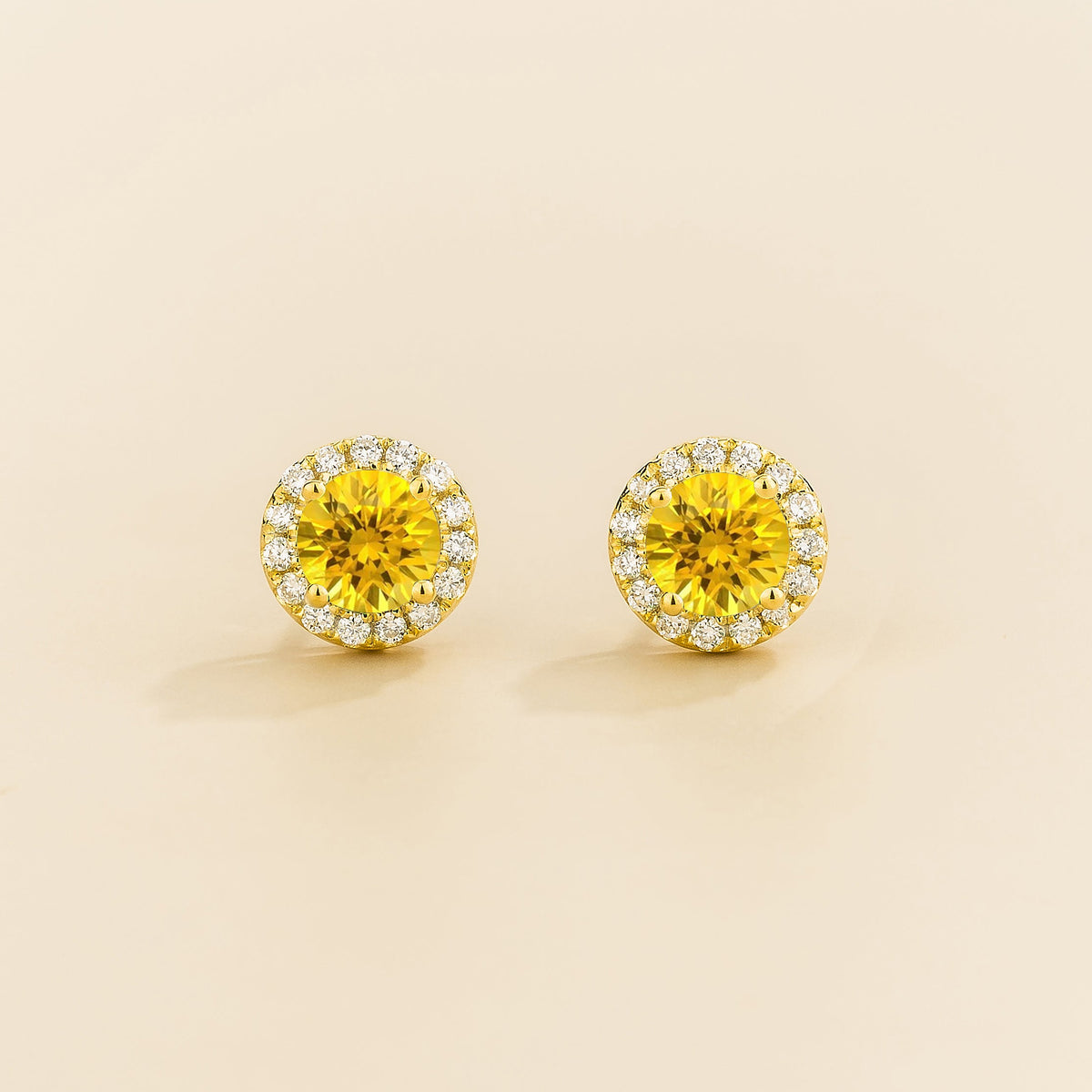 Round lab-grown yellow sapphire and diamond halo Mars earrings in gold | Juvetti London