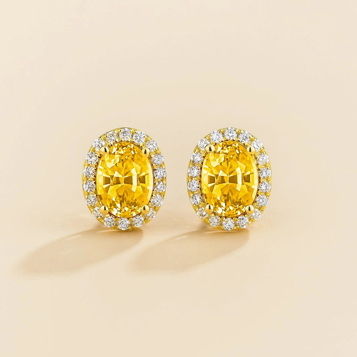 Lab-grown yellow sapphire and diamond oval halo stud earrings in gold – front view | Mina by Juvetti