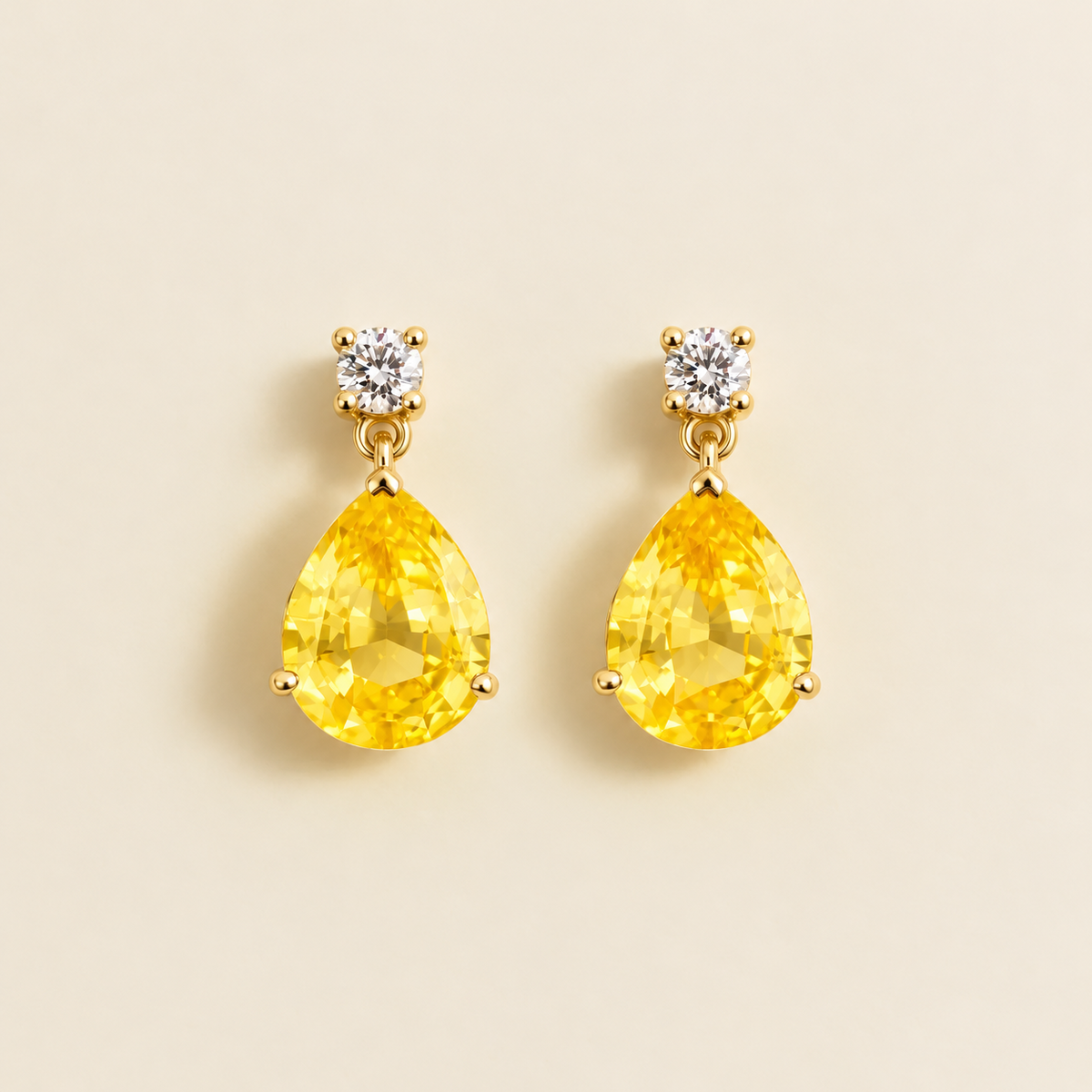 Medium lab-grown yellow sapphire and diamond pear drop earrings in gold – front view | Pisa by Juvetti