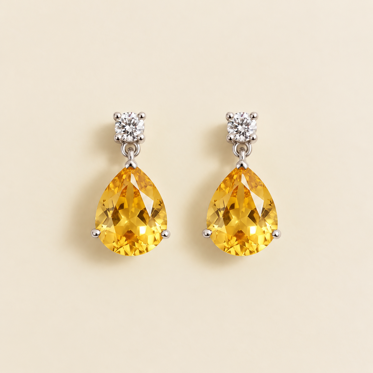 Medium lab-grown yellow sapphire and diamond pear drop earrings in white gold – front view | Pisa by Juvetti