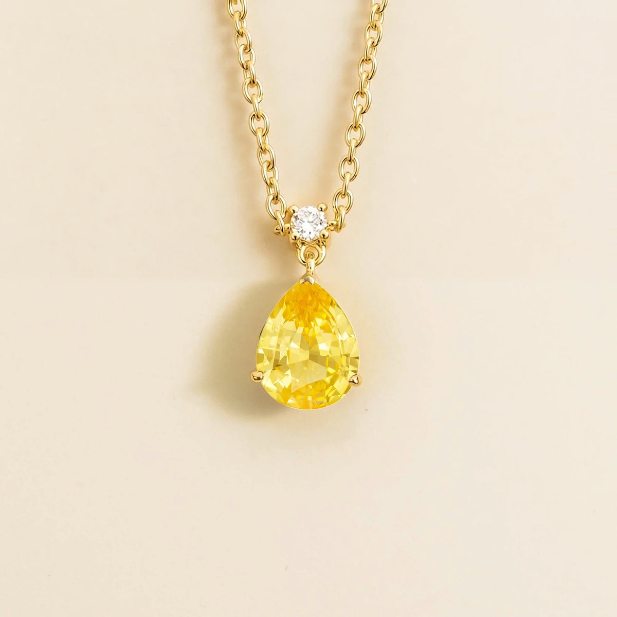 Lab-grown yellow sapphire and diamond pear drop pendant necklace in gold, medium – front view | Pisa by Juvetti