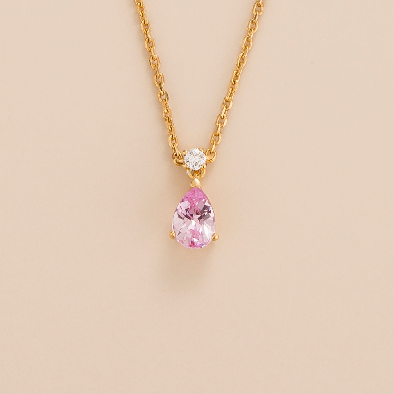 Ori necklace in 18K gold vermeil set with lab grown pear drop pink sapphire and round diamond gem stones.