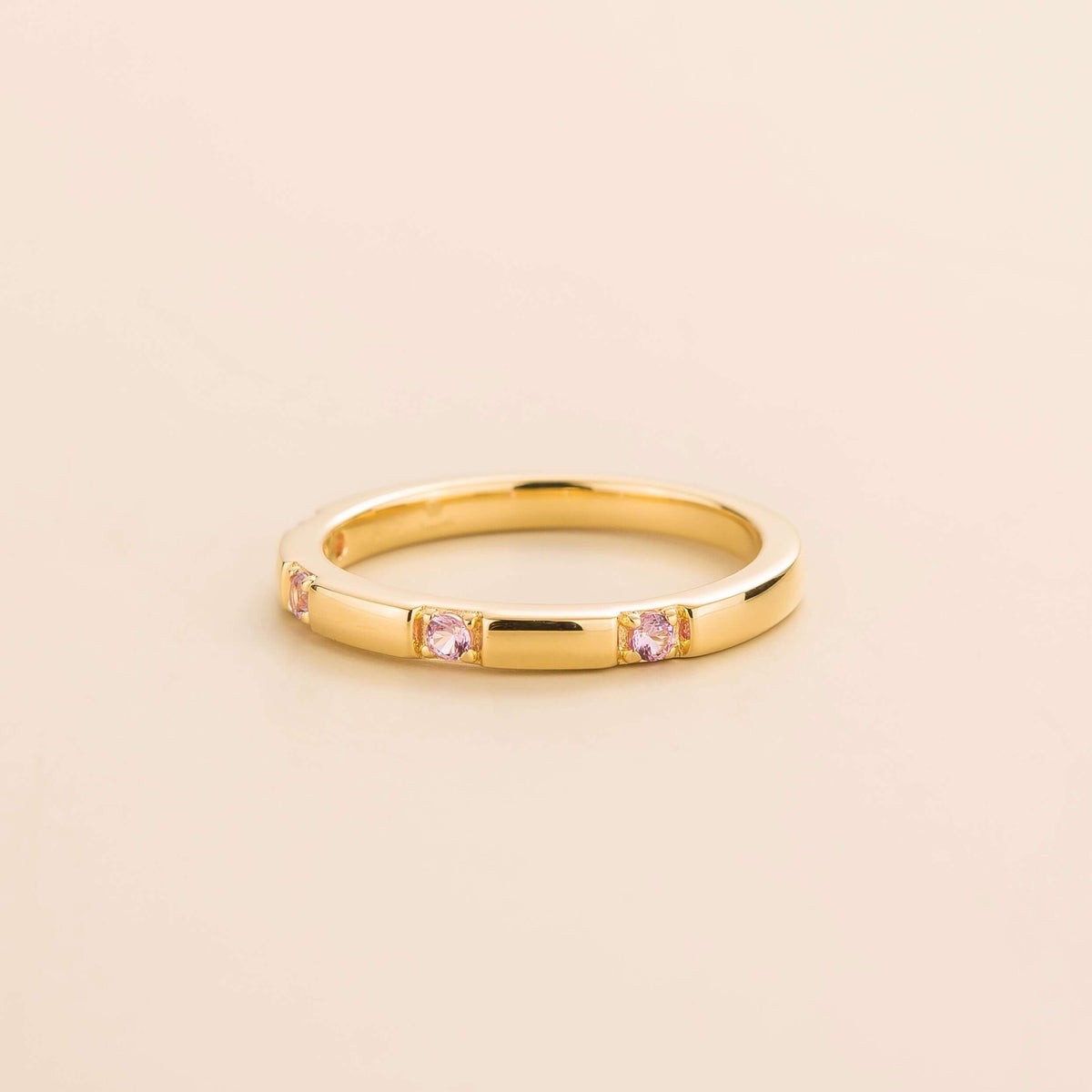 Balans Pink Sapphire Station Band Ring in Gold – angle view