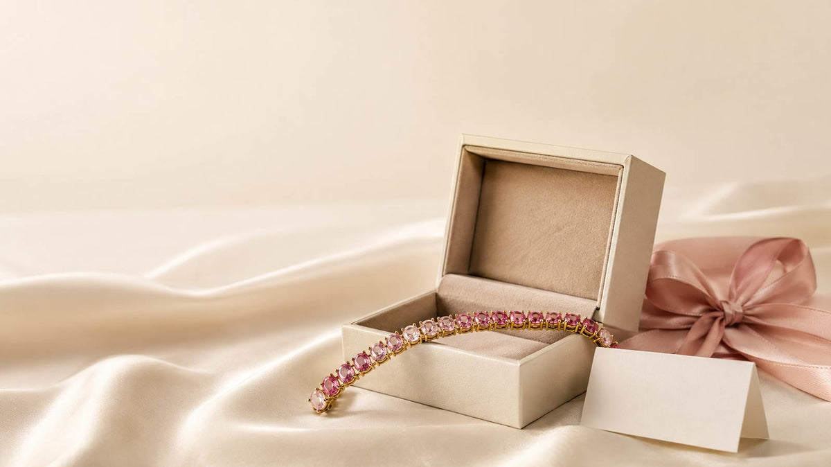 Pink sapphire bracelet gift in an open jewellery box