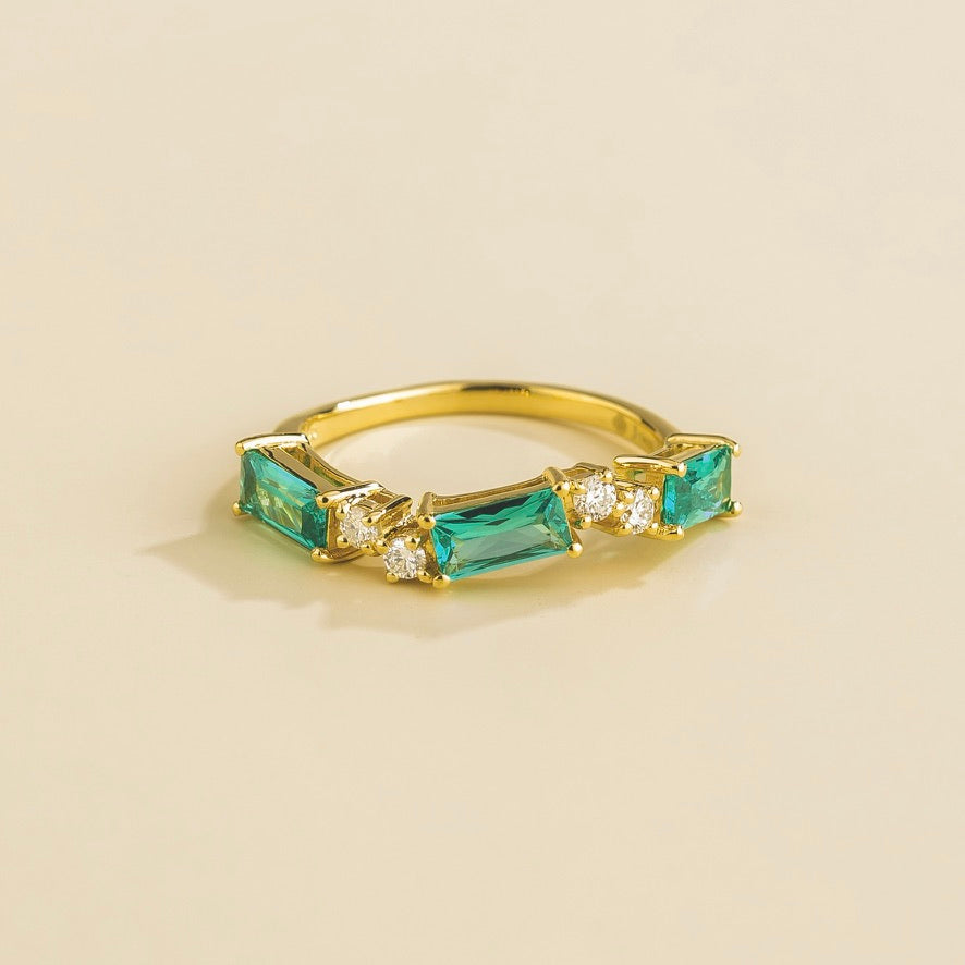 Baguette-cut lab-grown Paraiba sapphire and diamond three-stone Forma ring in gold | Juvetti London