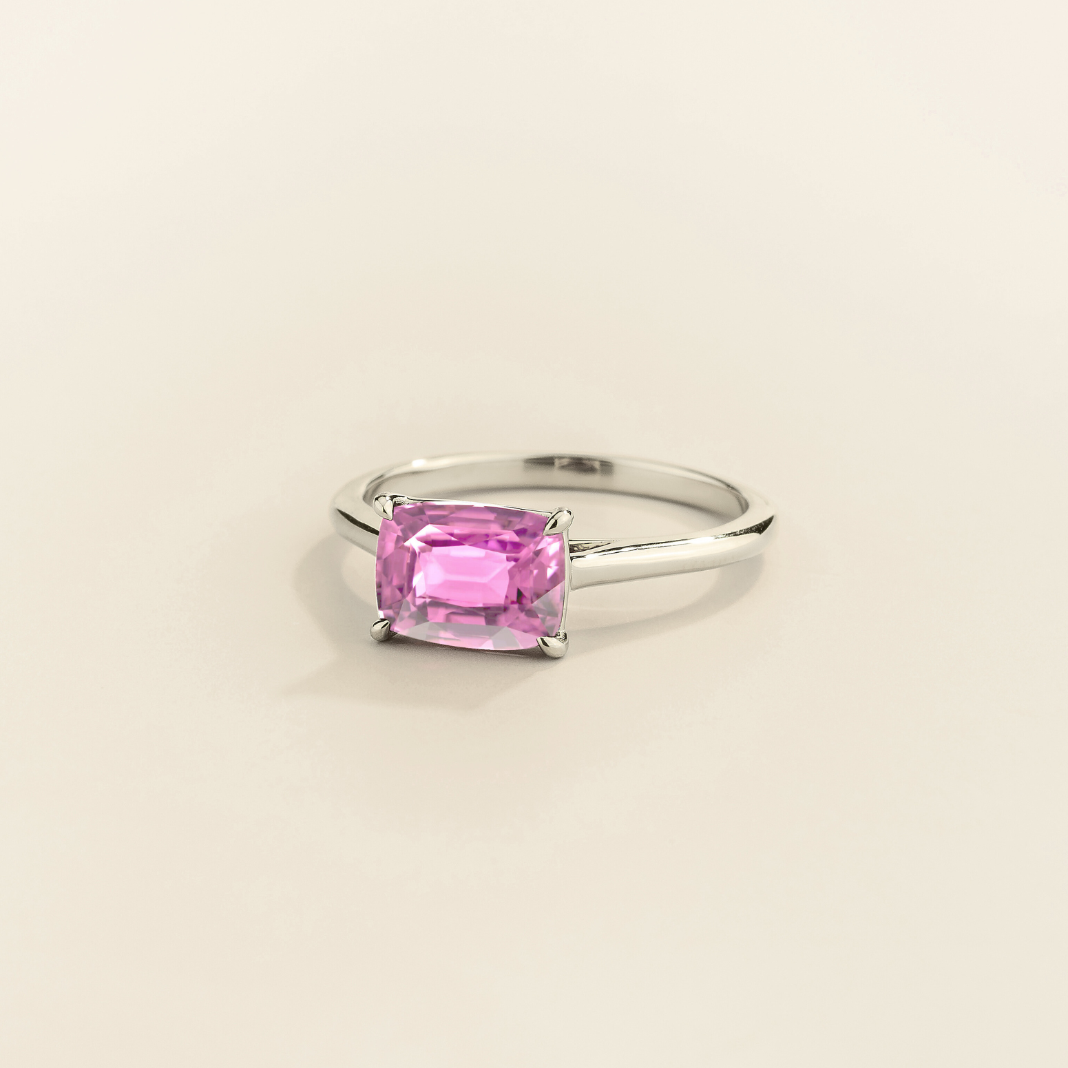 Kissen Ring in white gold, set with a Pink Sapphire in an east–west setting.