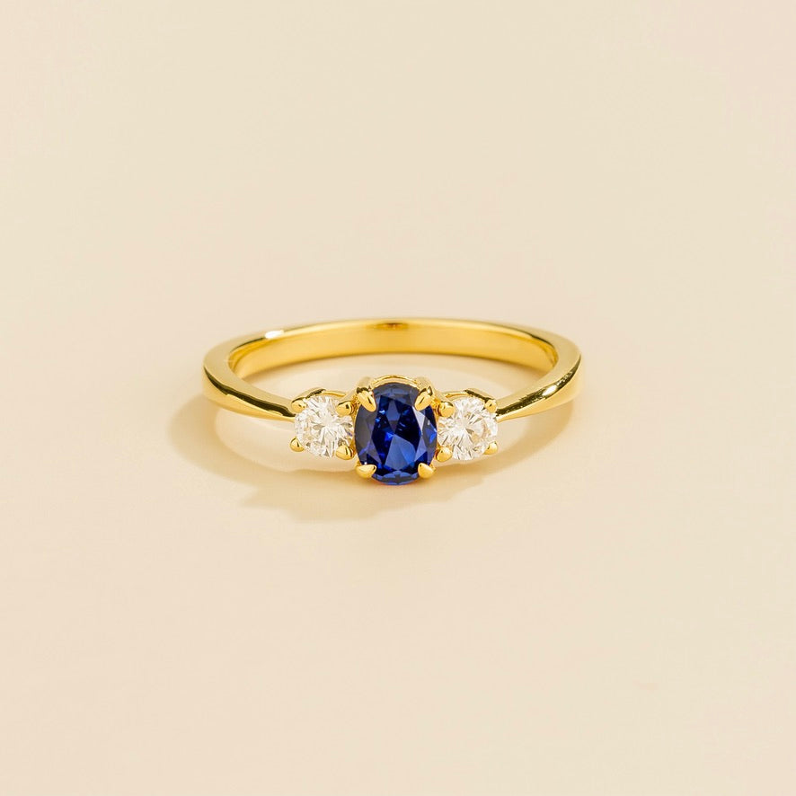 Oval lab-grown blue sapphire and diamond three-stone Boble ring in gold | Juvetti London