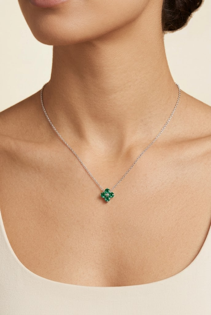 A model is wearing Clover Emerald Necklace in White Gold set with Round cut Emerald Gemstone.