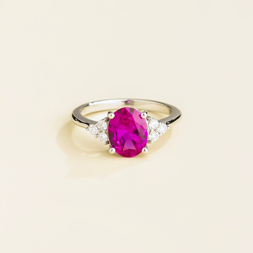 Oval lab-grown vivid pink sapphire solitaire with diamond shoulders, Ovo ring in white gold | Juvetti London