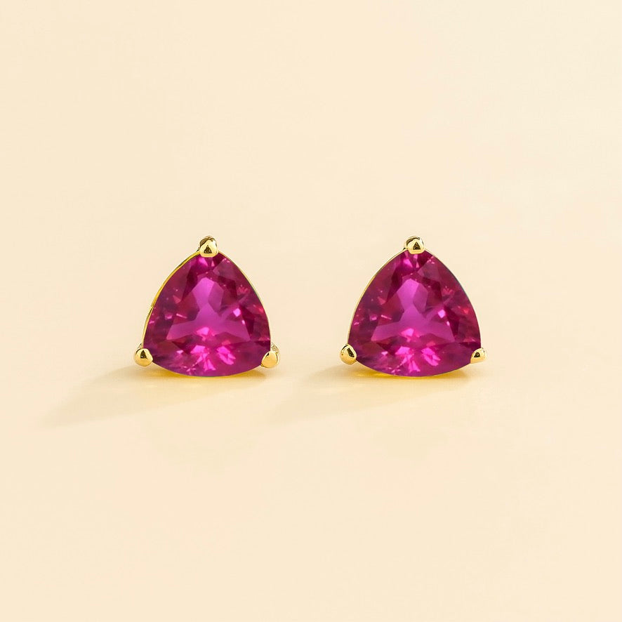 Trillion-cut lab-grown vivid pink sapphire solitaire stud earrings in gold | Juvetti London