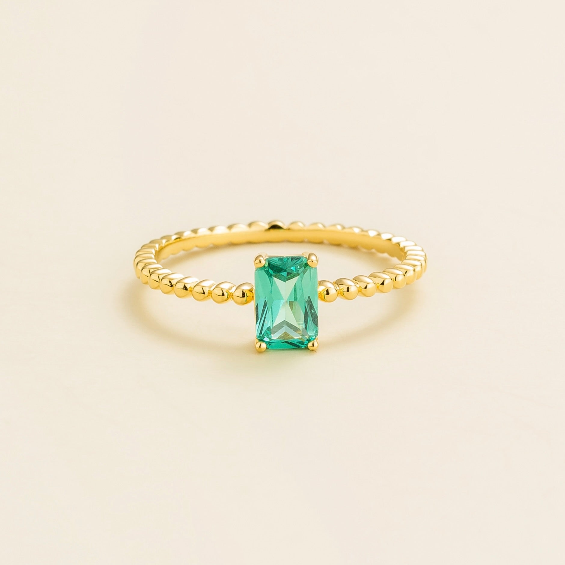Emerald-cut lab-grown Paraiba sapphire beaded band Fondi ring in gold | Juvetti London