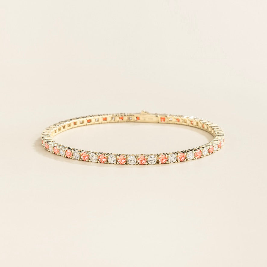 Round lab-grown padparadscha sapphire and diamond tennis bracelet in white gold | Juvetti London