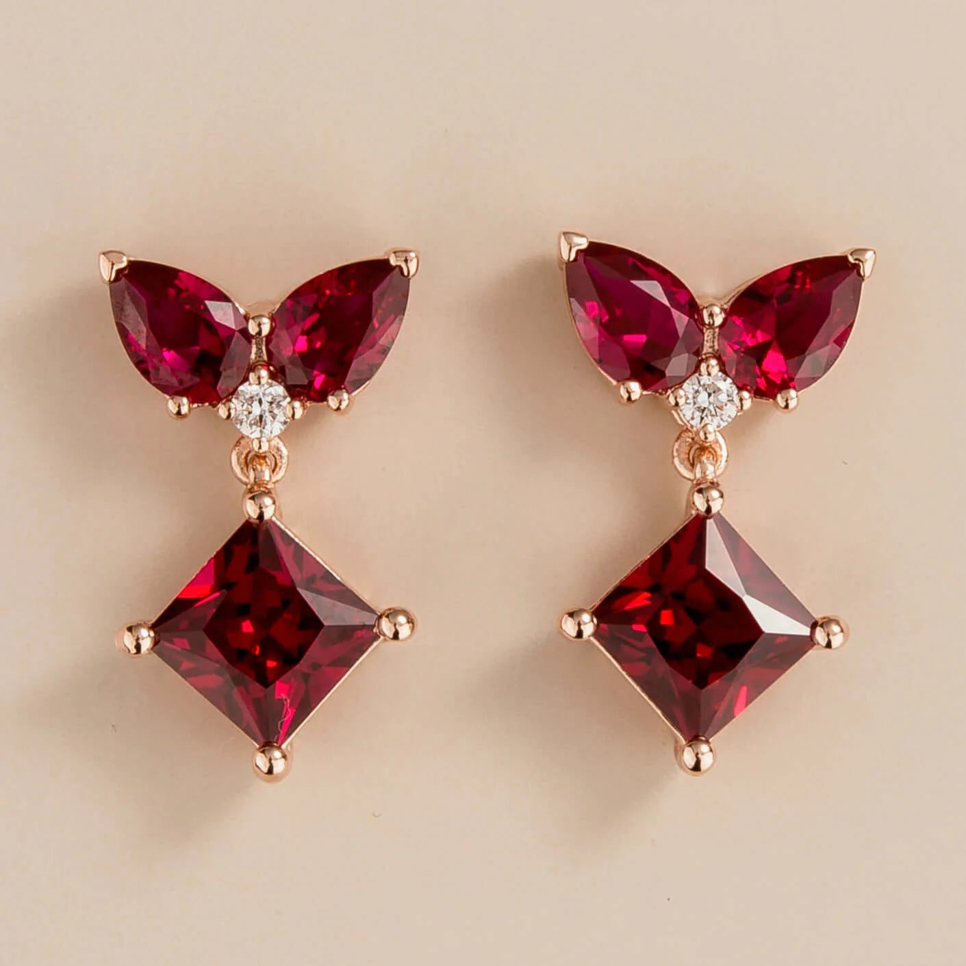 Amore earrings in 18k pink gold vermeil set with lab grown diamond and ruby gem stones.