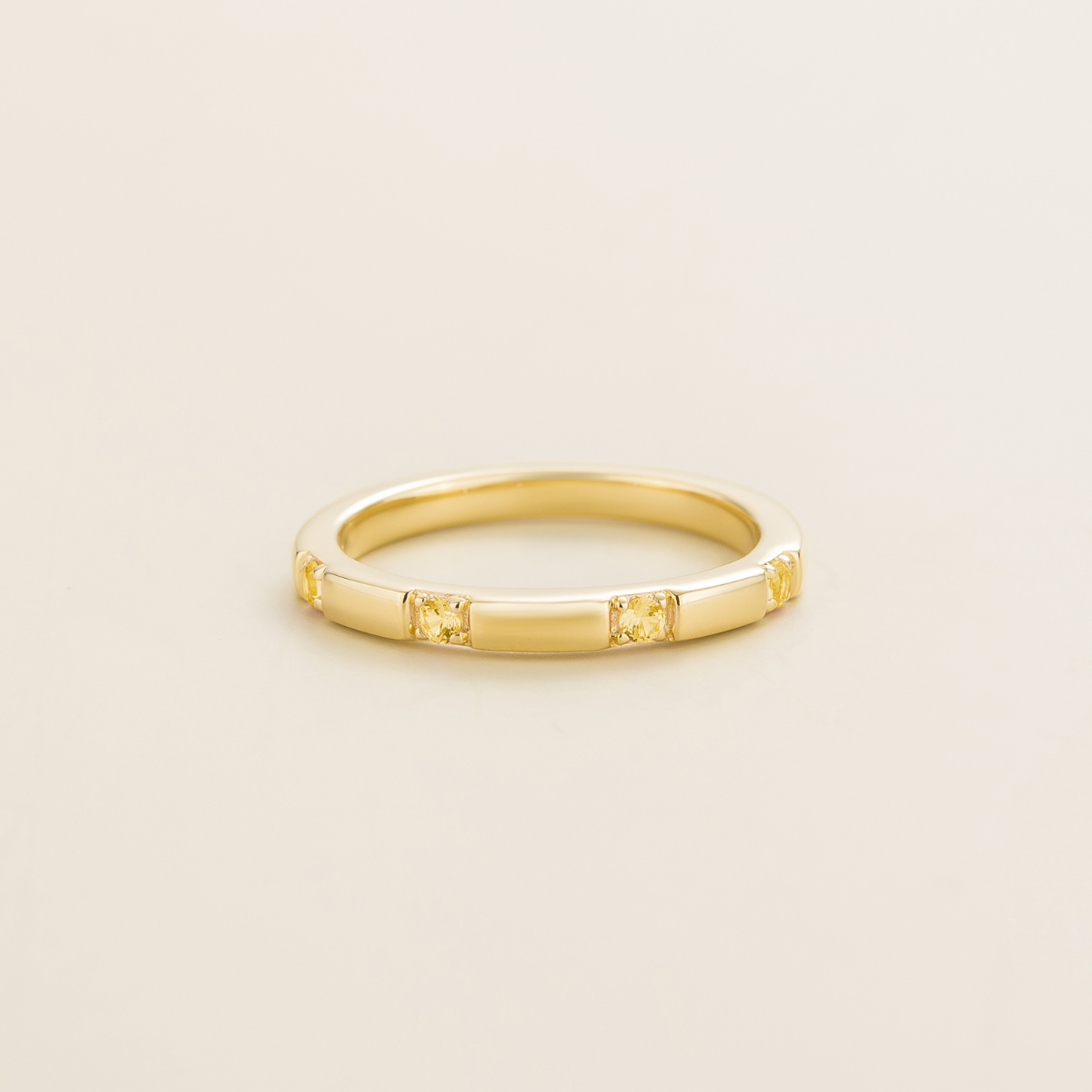 Gold ring with small round yellow sapphire gem stones. Simple and classic