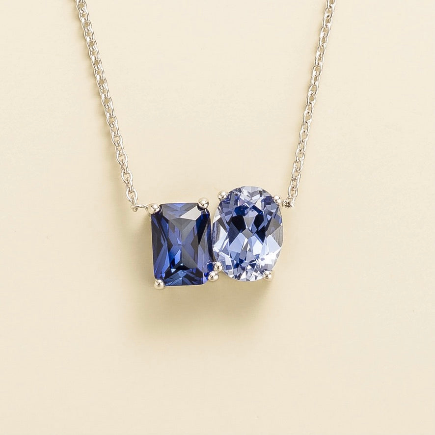 Buchon white gold necklace featuring emerald-cut and oval lab-grown blue sapphires | Juvetti London