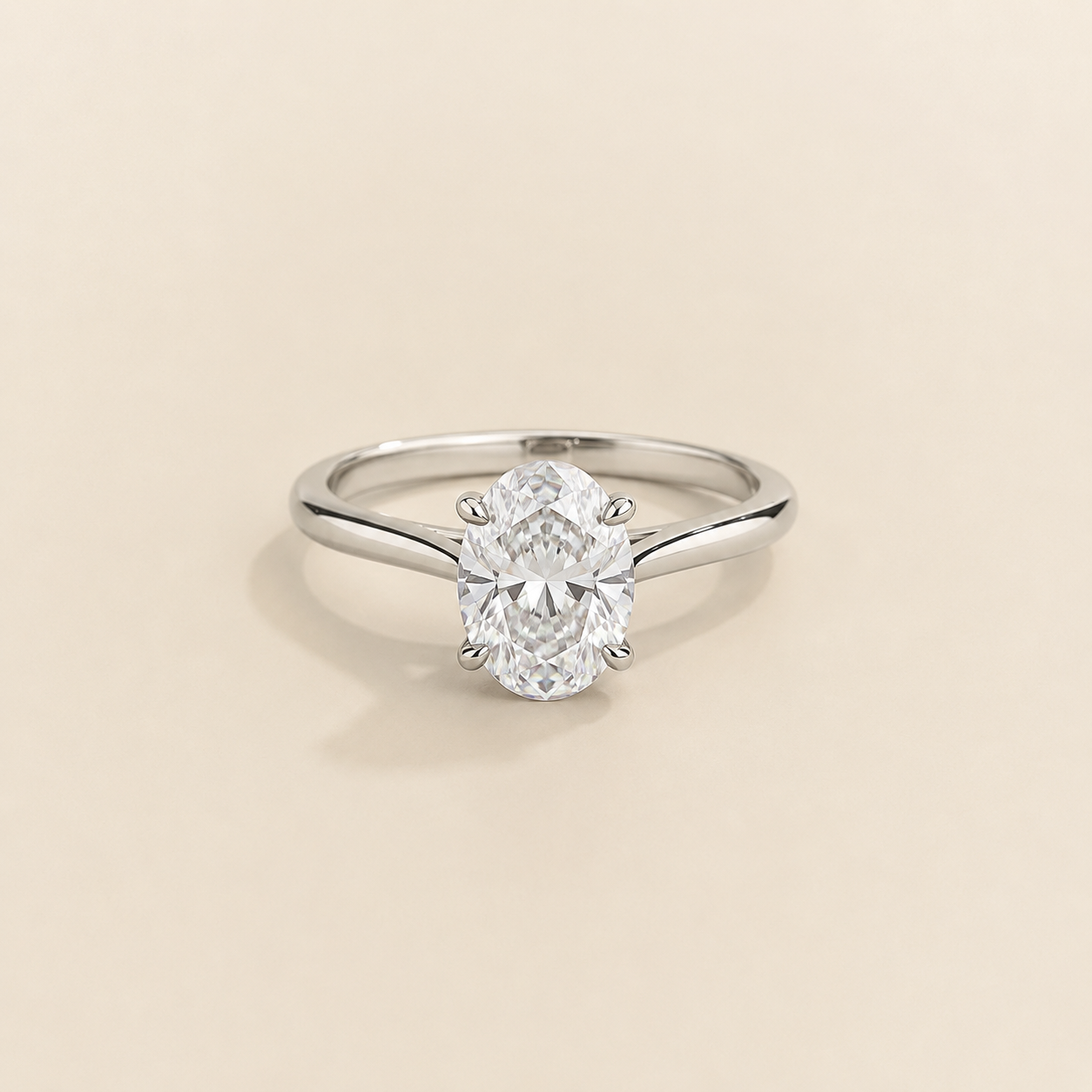 Kissen Ring in white gold, set with a Oval cut Diamond in an east–west setting.