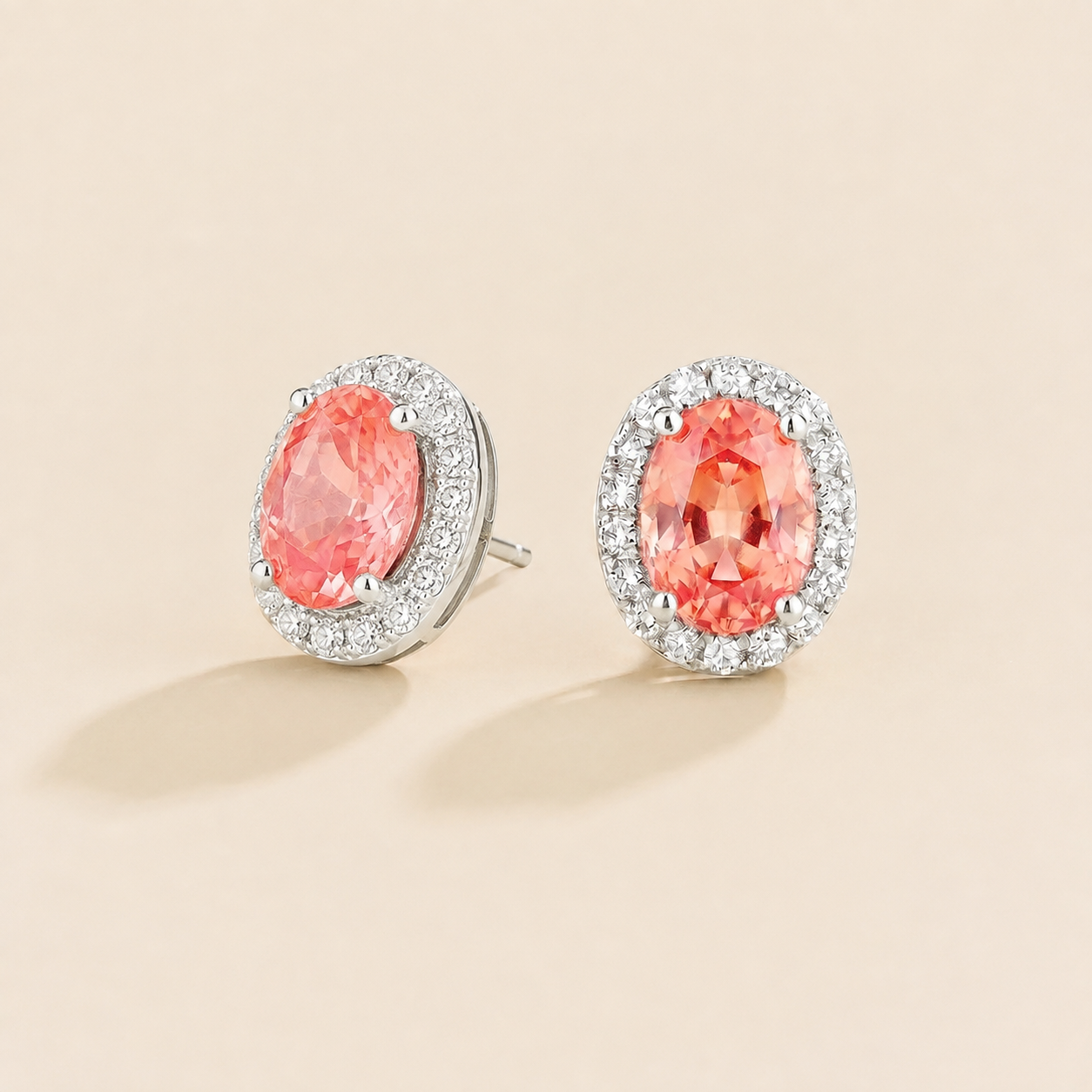 Mina Oval Padparadscha Sapphire & Diamond Halo Earrings In White Gold Angle View 