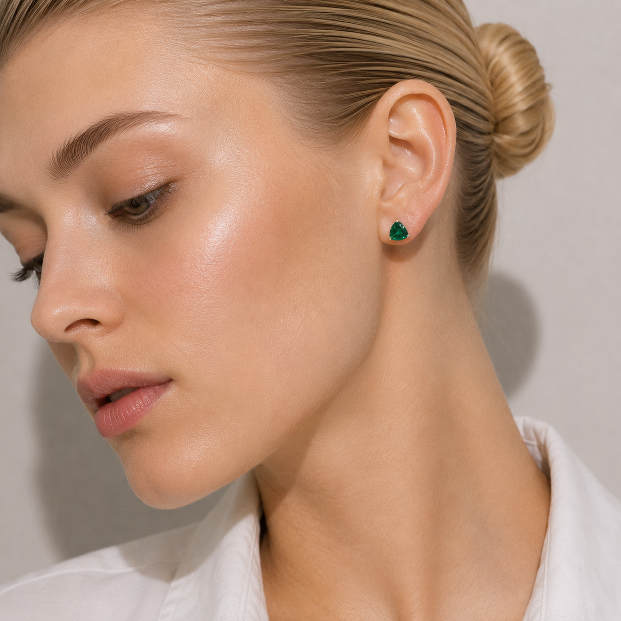 Trillion Emerald Solitaire Stud Earrings in White Gold