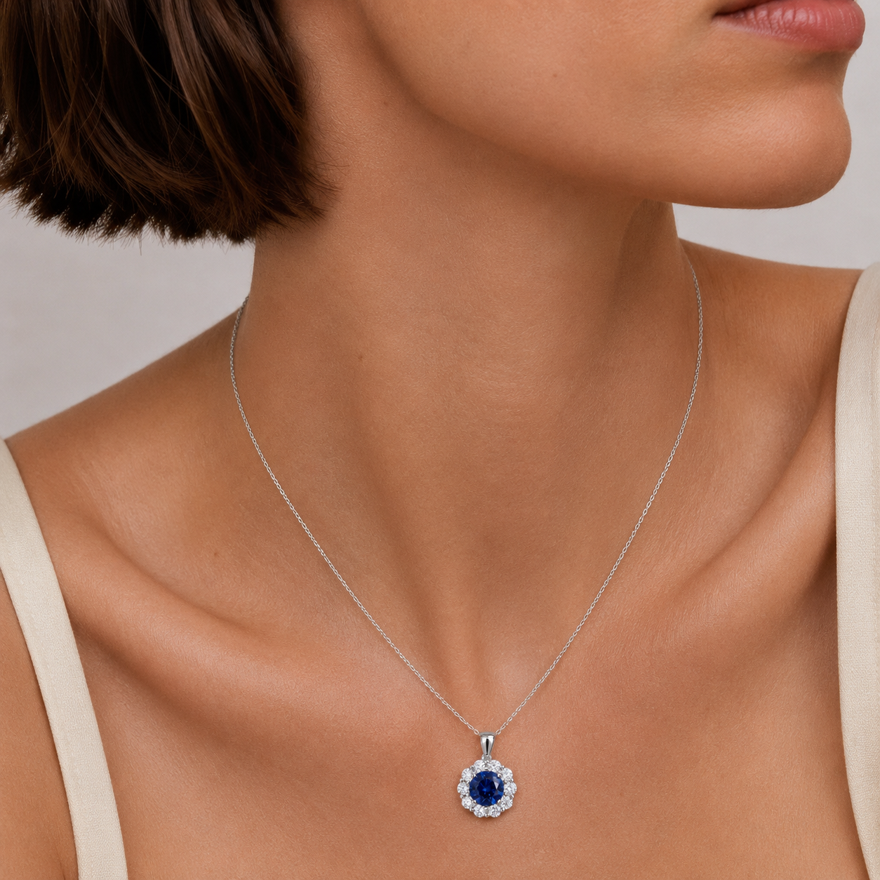 Floret Blue Sapphire Round & Diamond Halo Pendant Necklace in White Gold