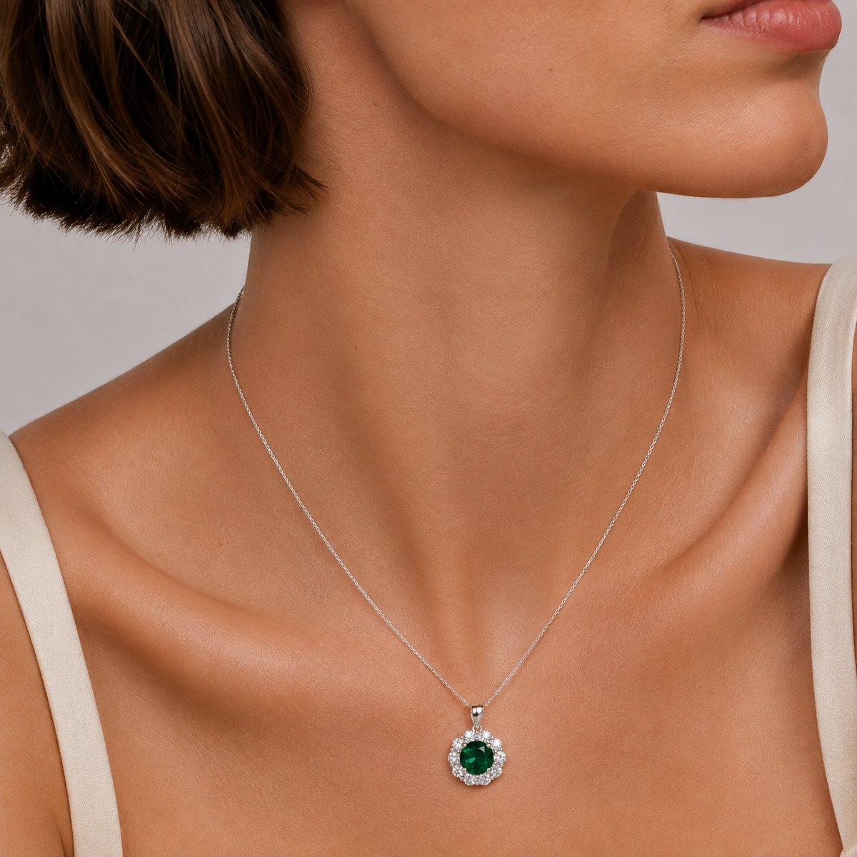 Floret Emerald Round & Diamond Halo Pendant Necklace in White Gold