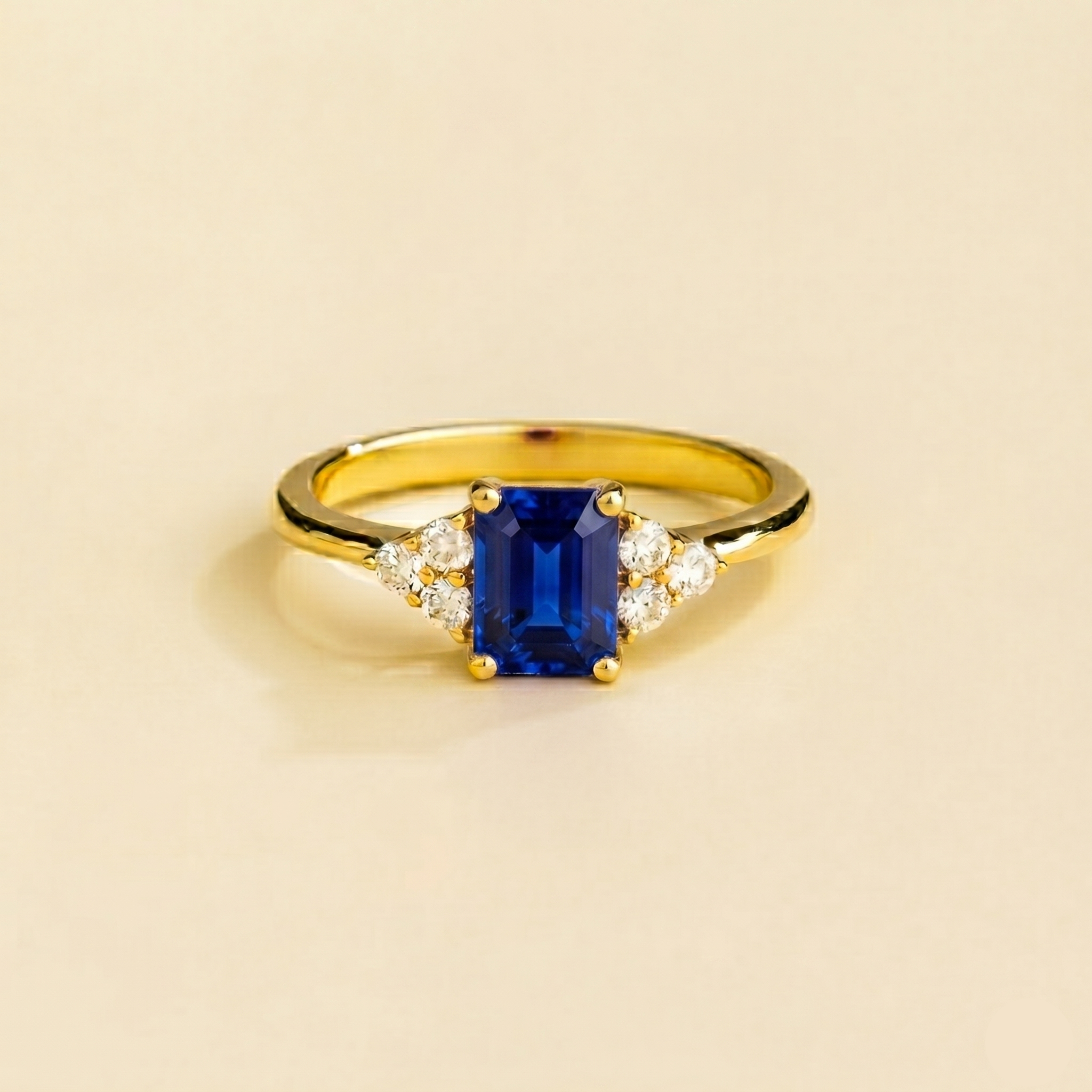 Emerald-cut lab-grown blue sapphire and diamond Chateau ring in gold | Juvetti London