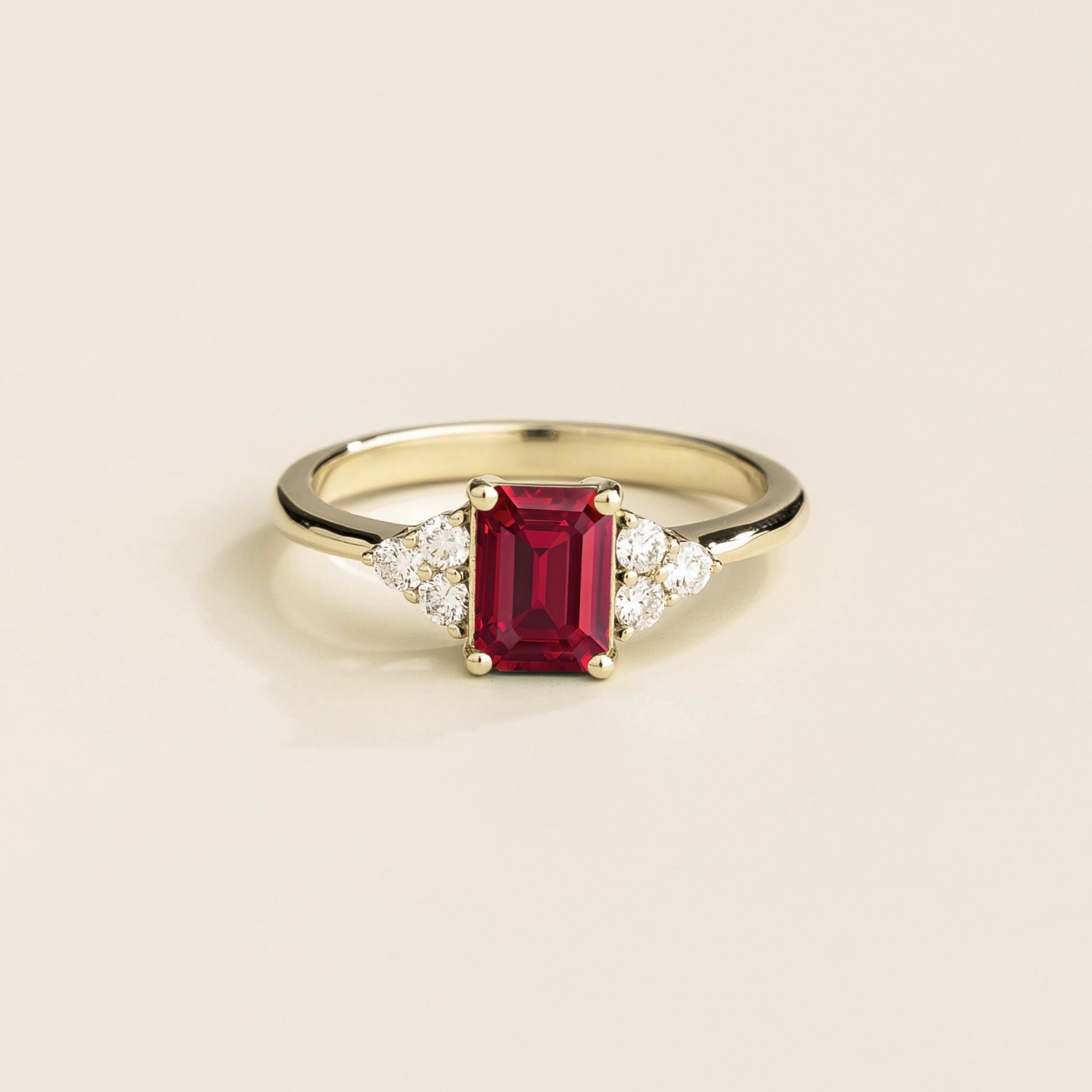 Juvetti white gold ring featuring an emerald-cut lab-grown ruby with lab-grown diamond side stones.