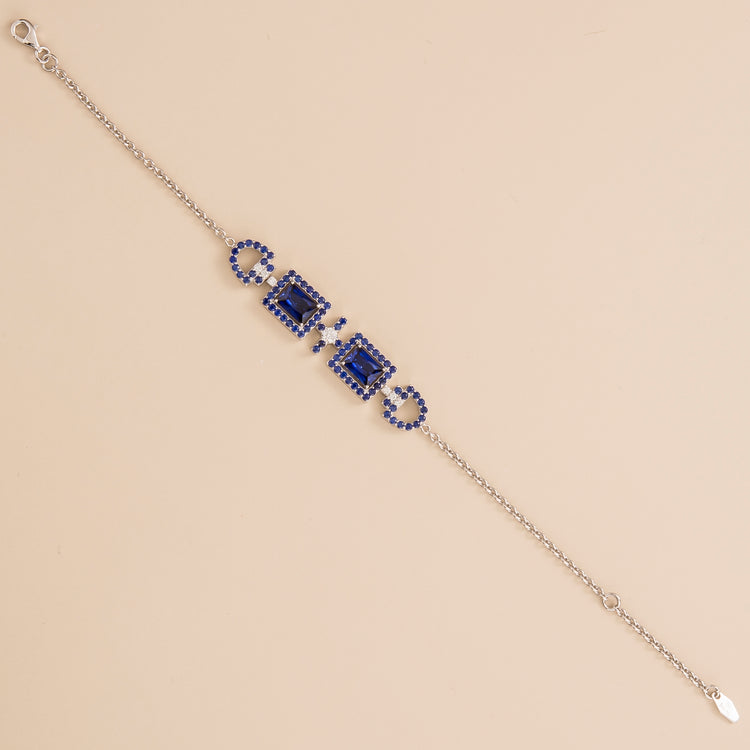 Ciceris bracelet in 18K white gold vermeil set with lab grown diamond and royal blue sapphire.