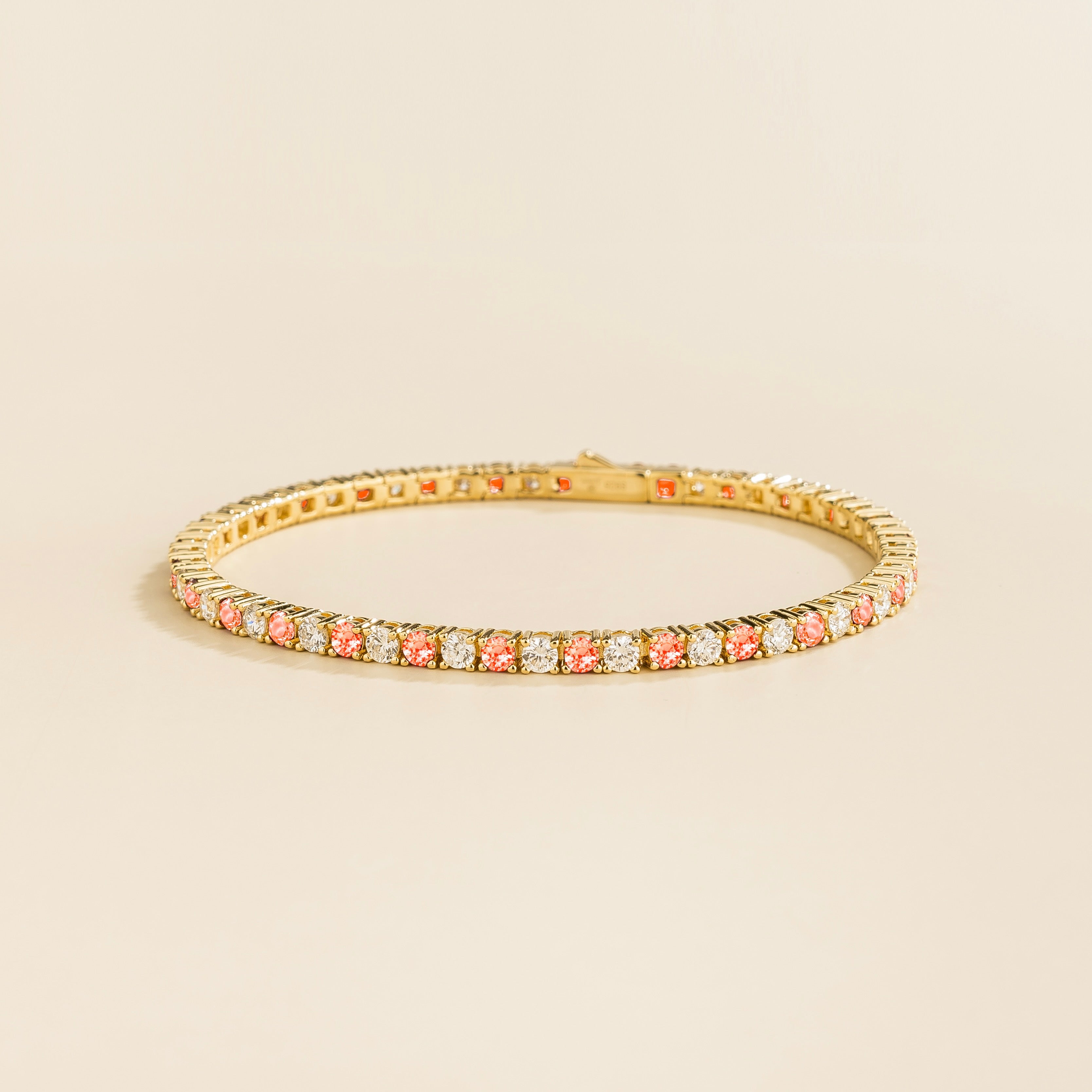 ciclo gold tennis bracelet with round padparadscha sapphire and lab grown diamonds