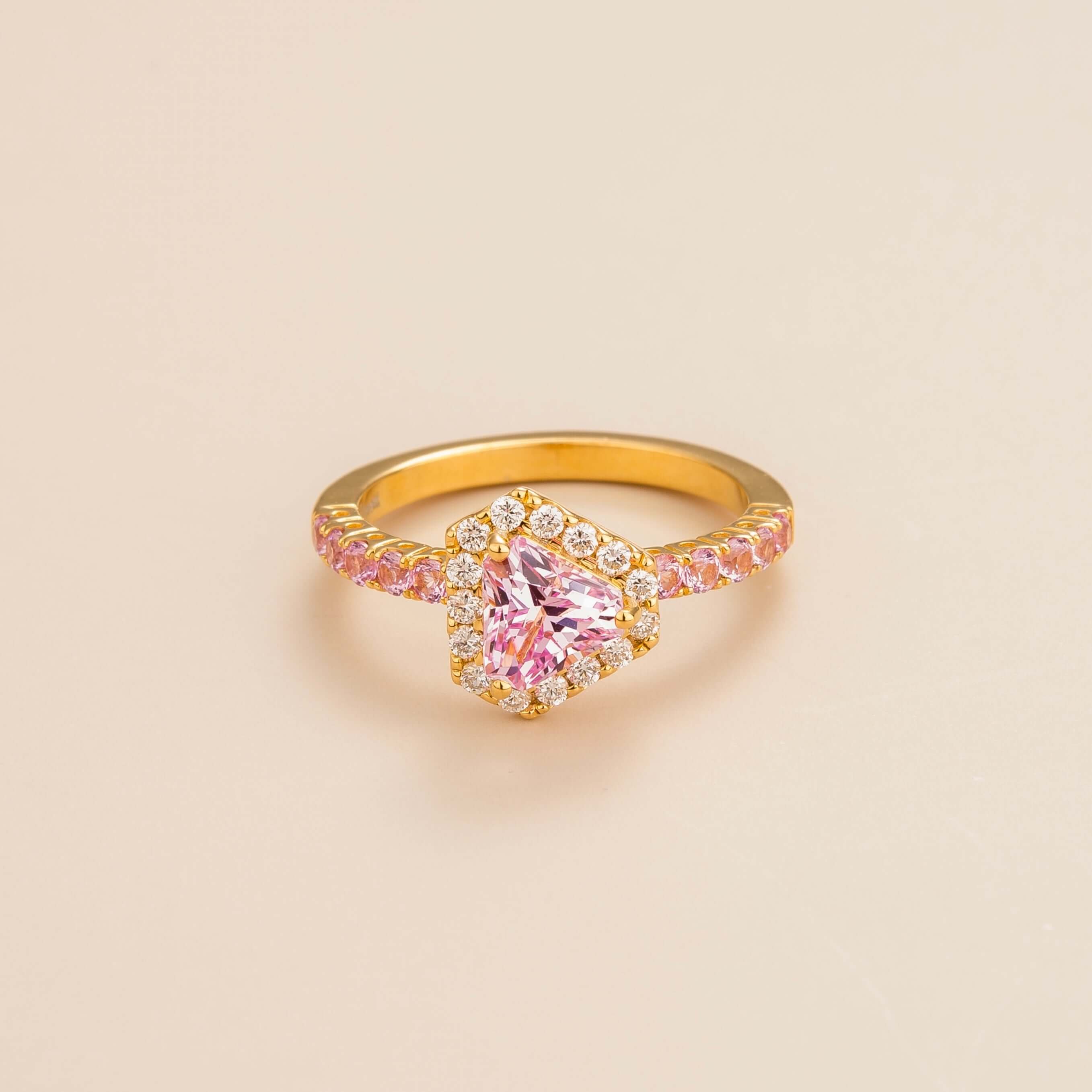 Diana ring in 18K gold vermeil set with lab grown diamond and triangle pink sapphire gem stones.