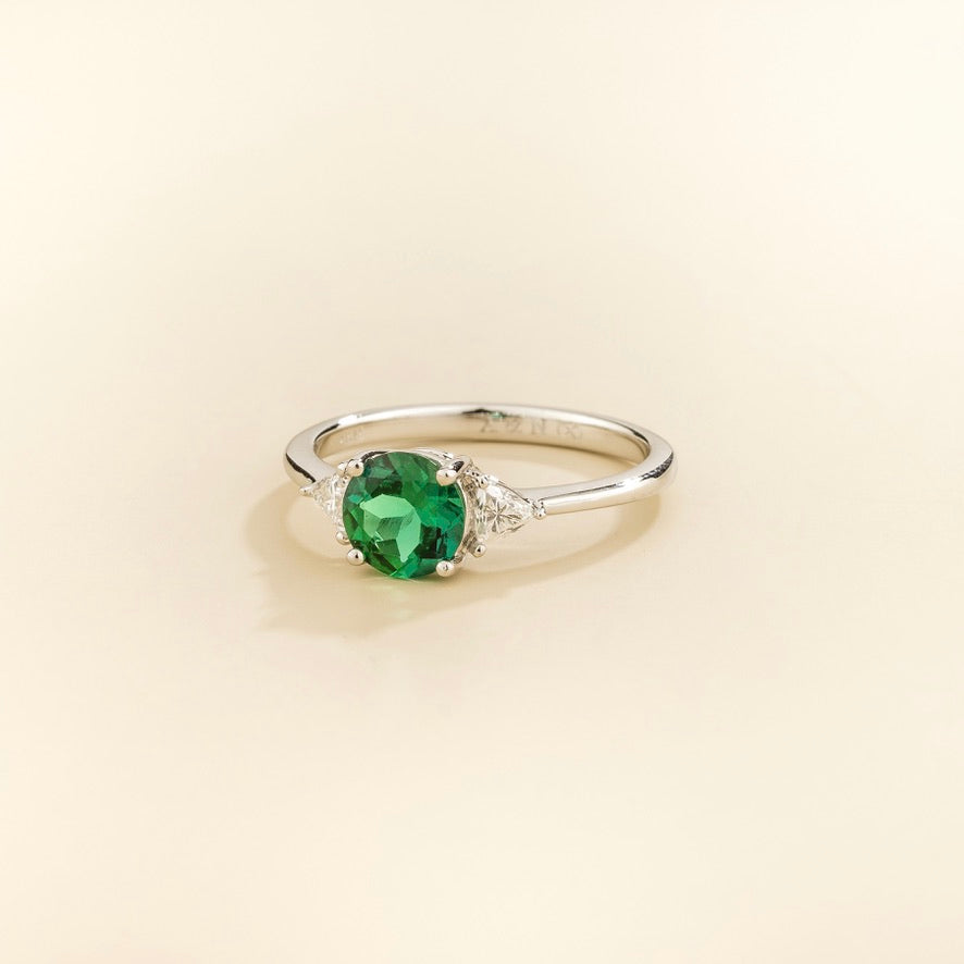 Lola Round Emerald Three-Stone Ring with Trillion Diamonds in White Gold