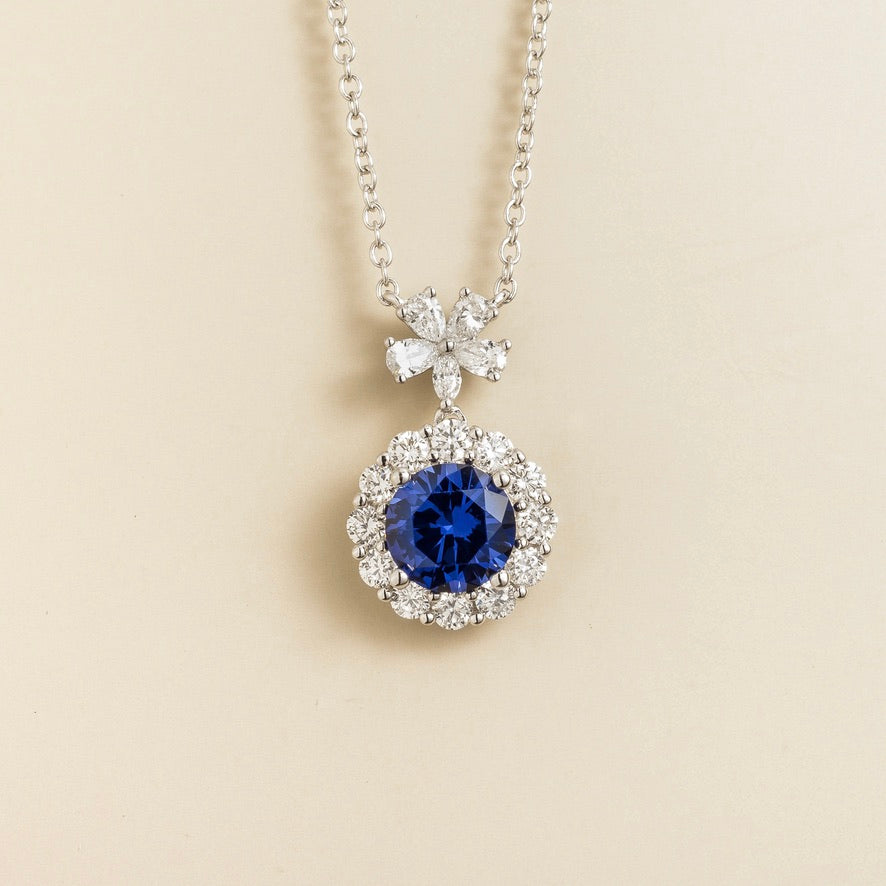 Round Blue Sapphire Halo Pendant Necklace with Flower Bail in White Gold