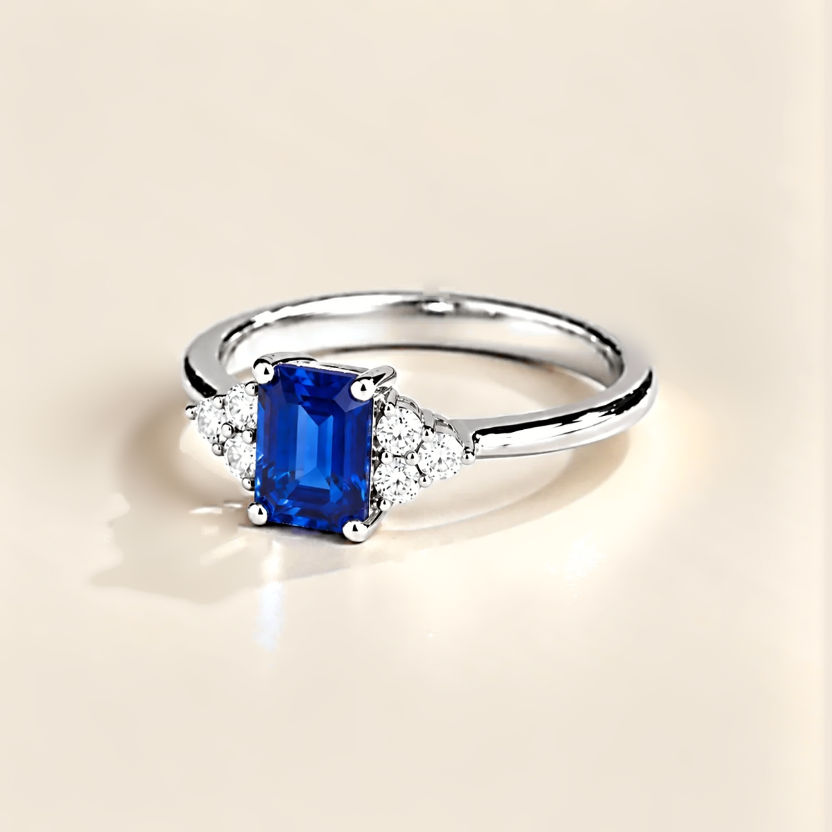 Emerald-cut lab-grown blue sapphire and diamond Chateau ring in white gold | Juvetti London