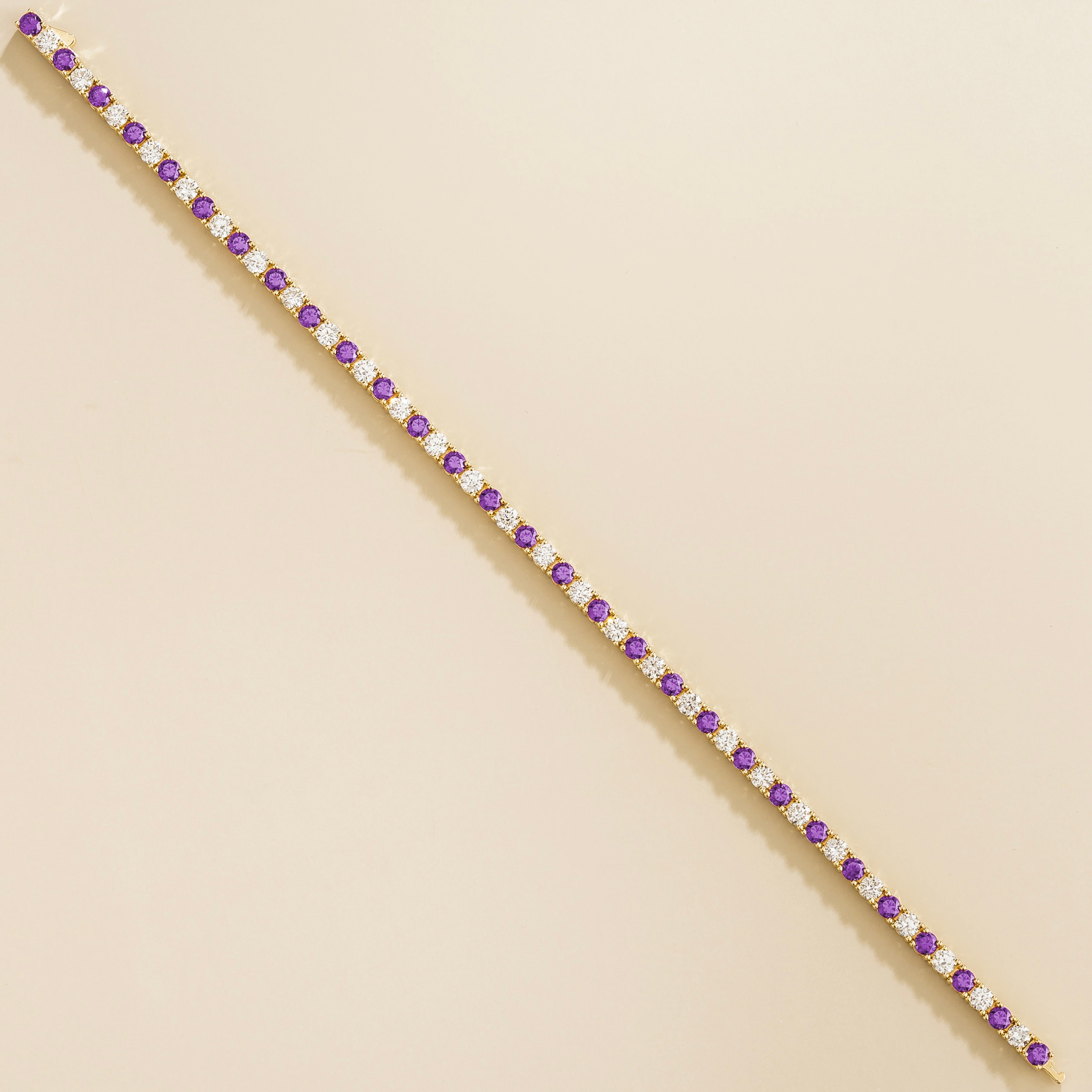 elegant gold tennis bracelet with purple sapphire and lab grown diamonds for women