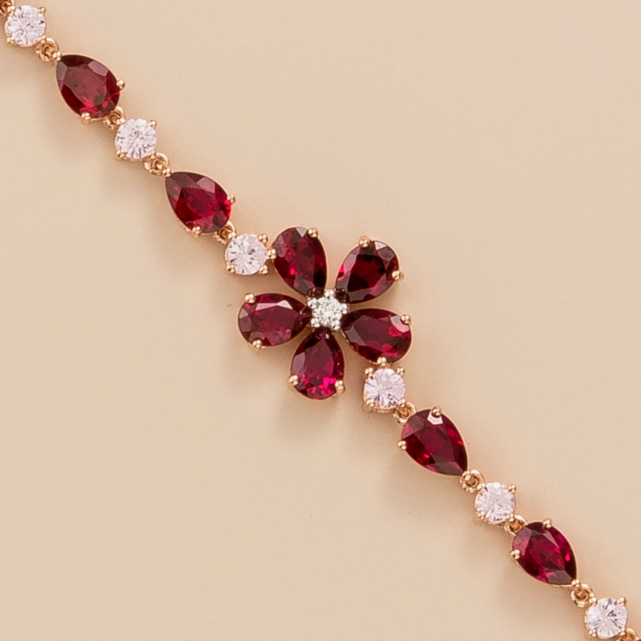 Florea flower floral bracelet in 18K pink gold vermeil set with lab grown diamond, ruby and pink sapphire gem stones.