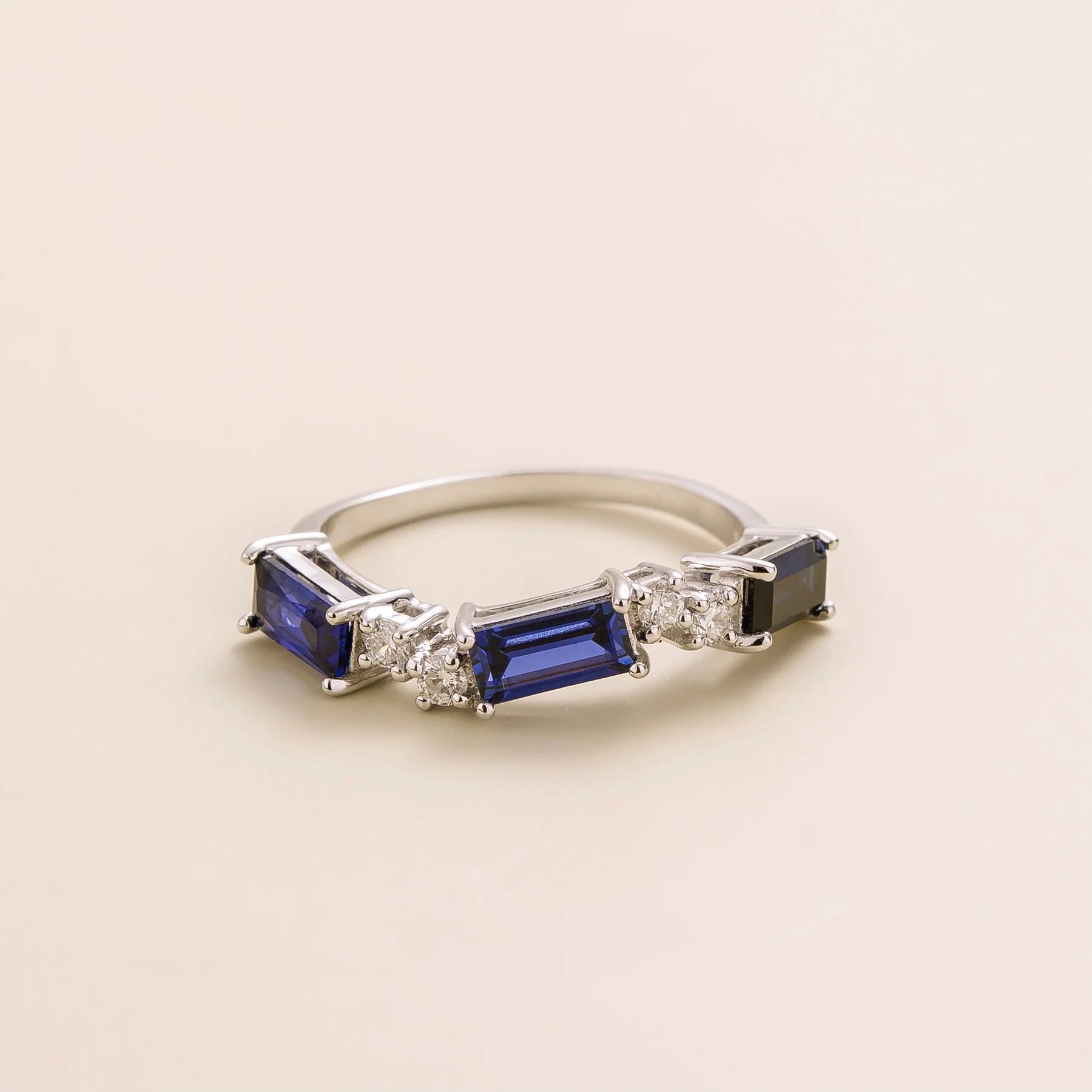 Forma white gold ring set with Blue Sapphire and Diamond Bespoke Jewellery From London