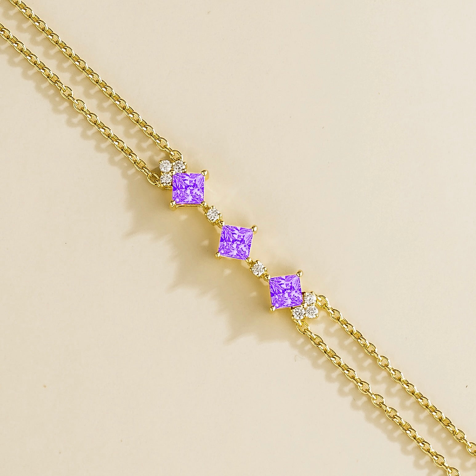 double chain gold bracelet featuring purple sapphire gemstones and lab grown diamonds