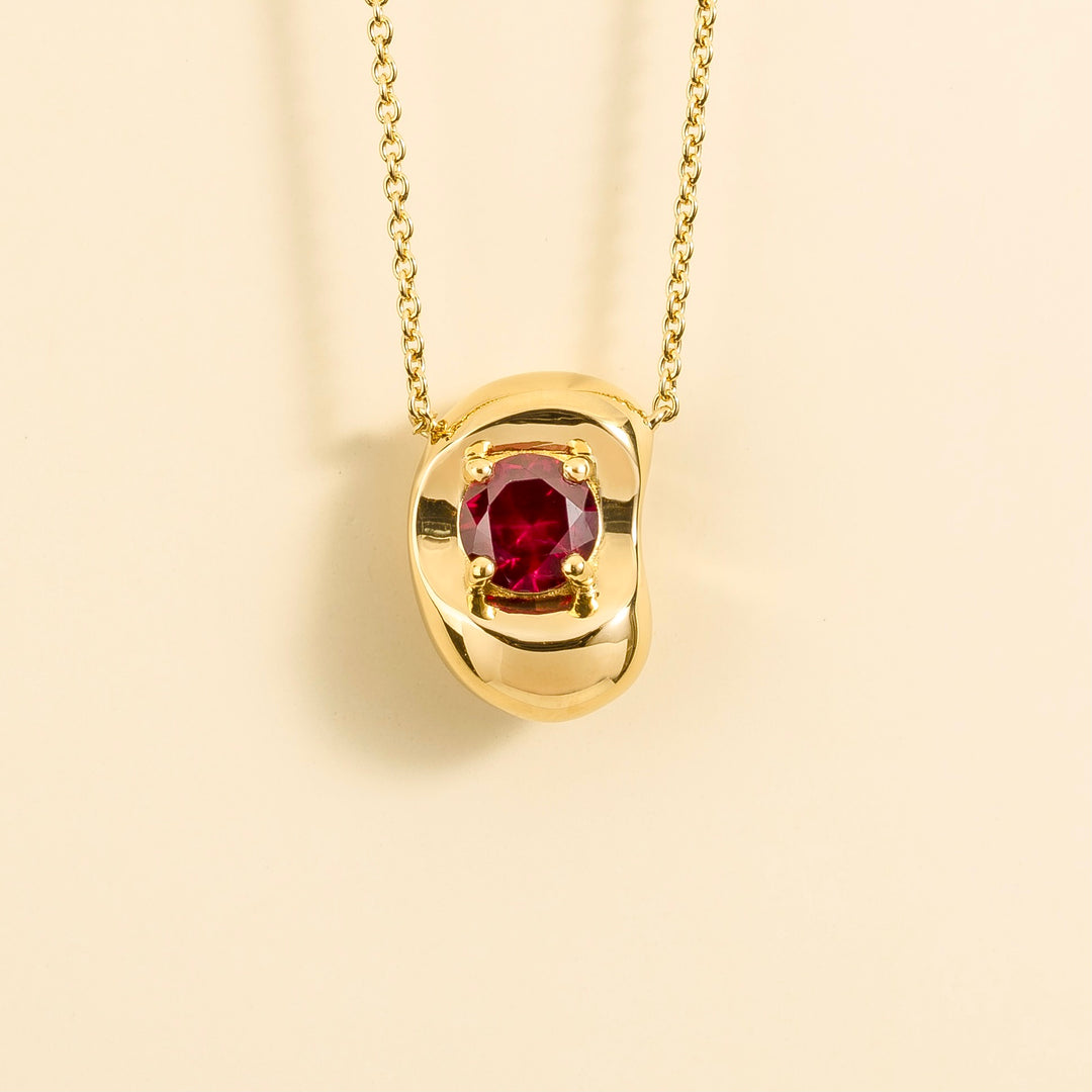 Fava gold necklace set with Ruby