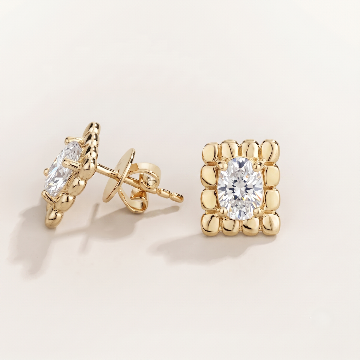 Fondi Oval Diamond Sculpted Gold Stud Earrings – angle view