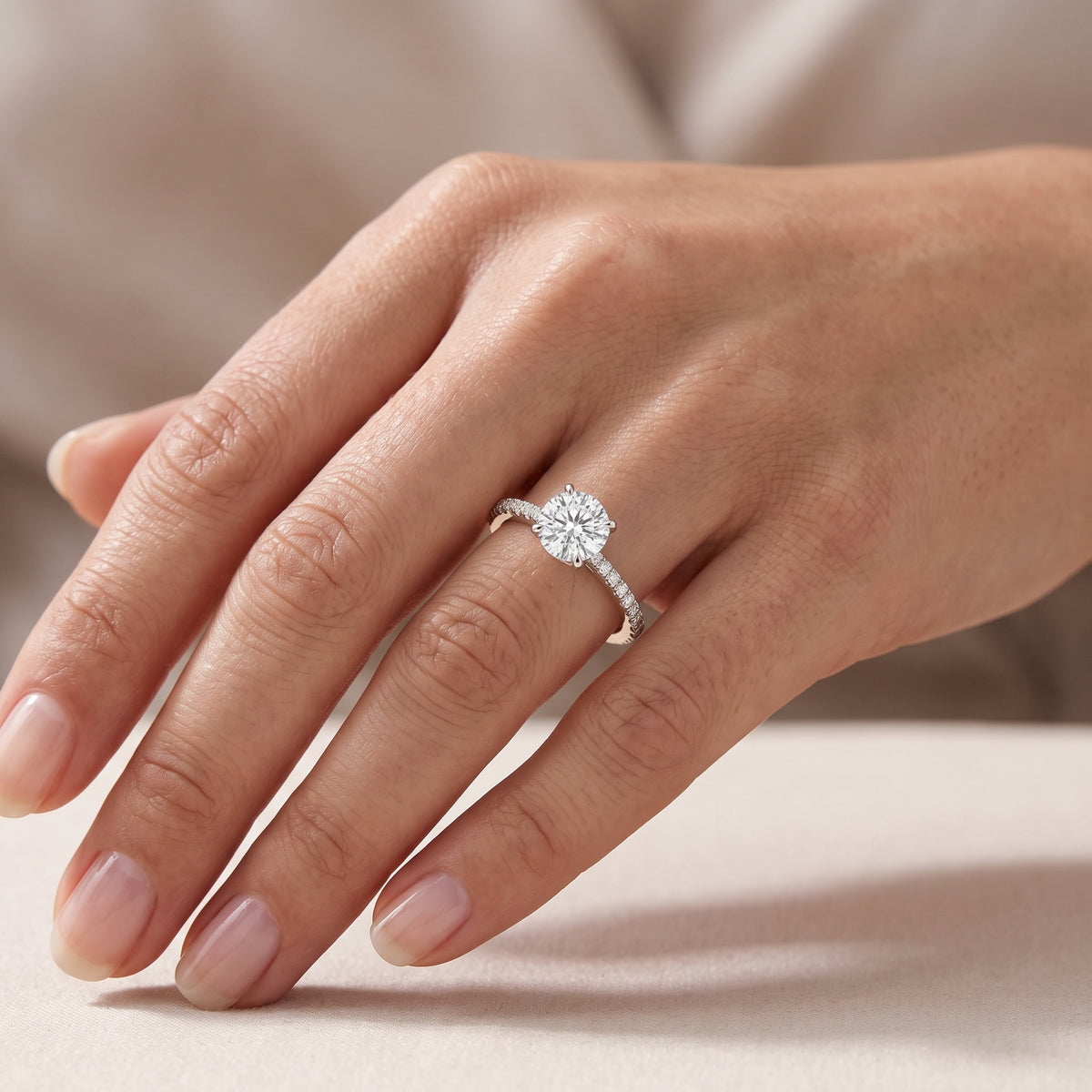 Soli Dimond ring in white gold worn on a model's hand, Juvetti London