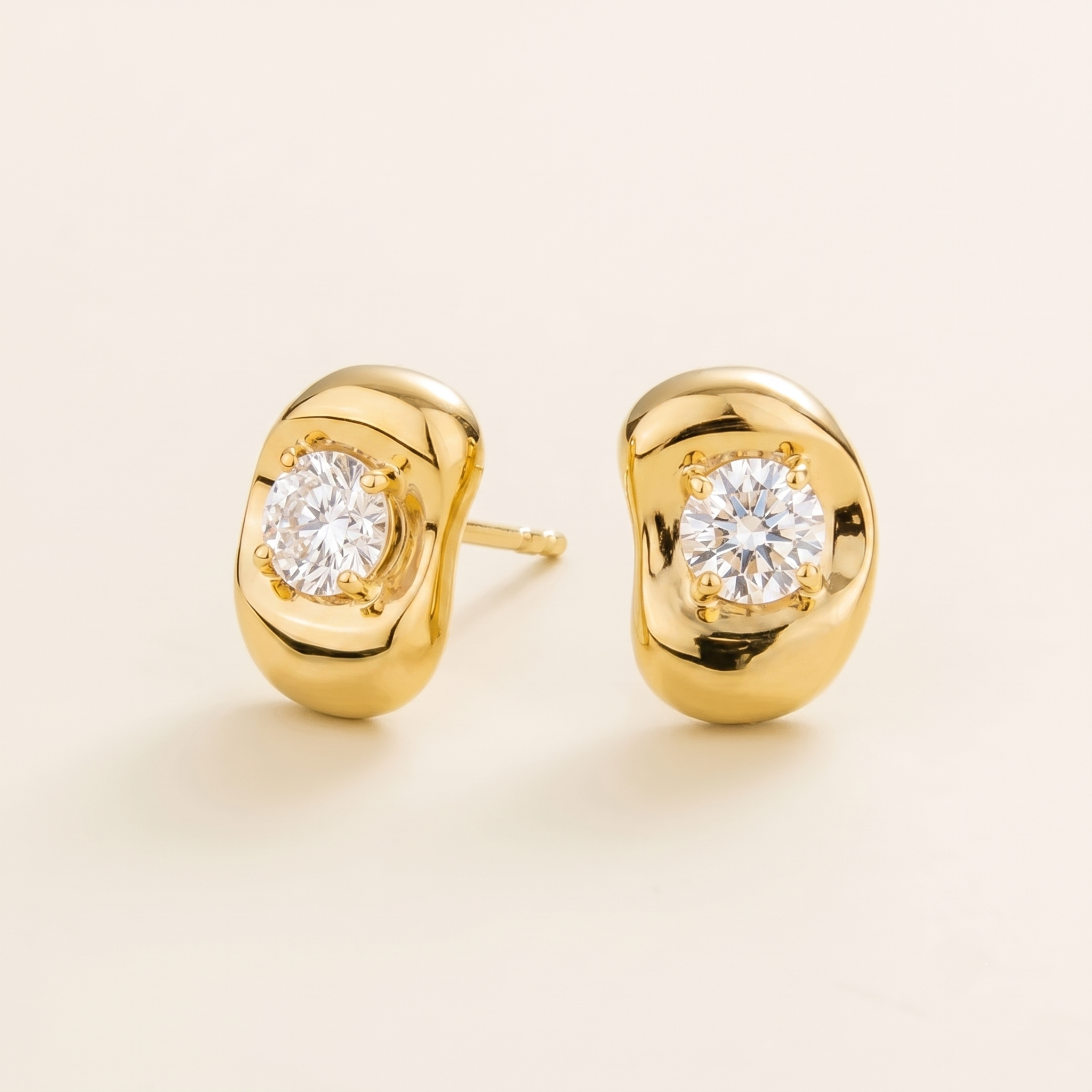 Fava Oval Diamond Stud Earrings in Gold – angle view
